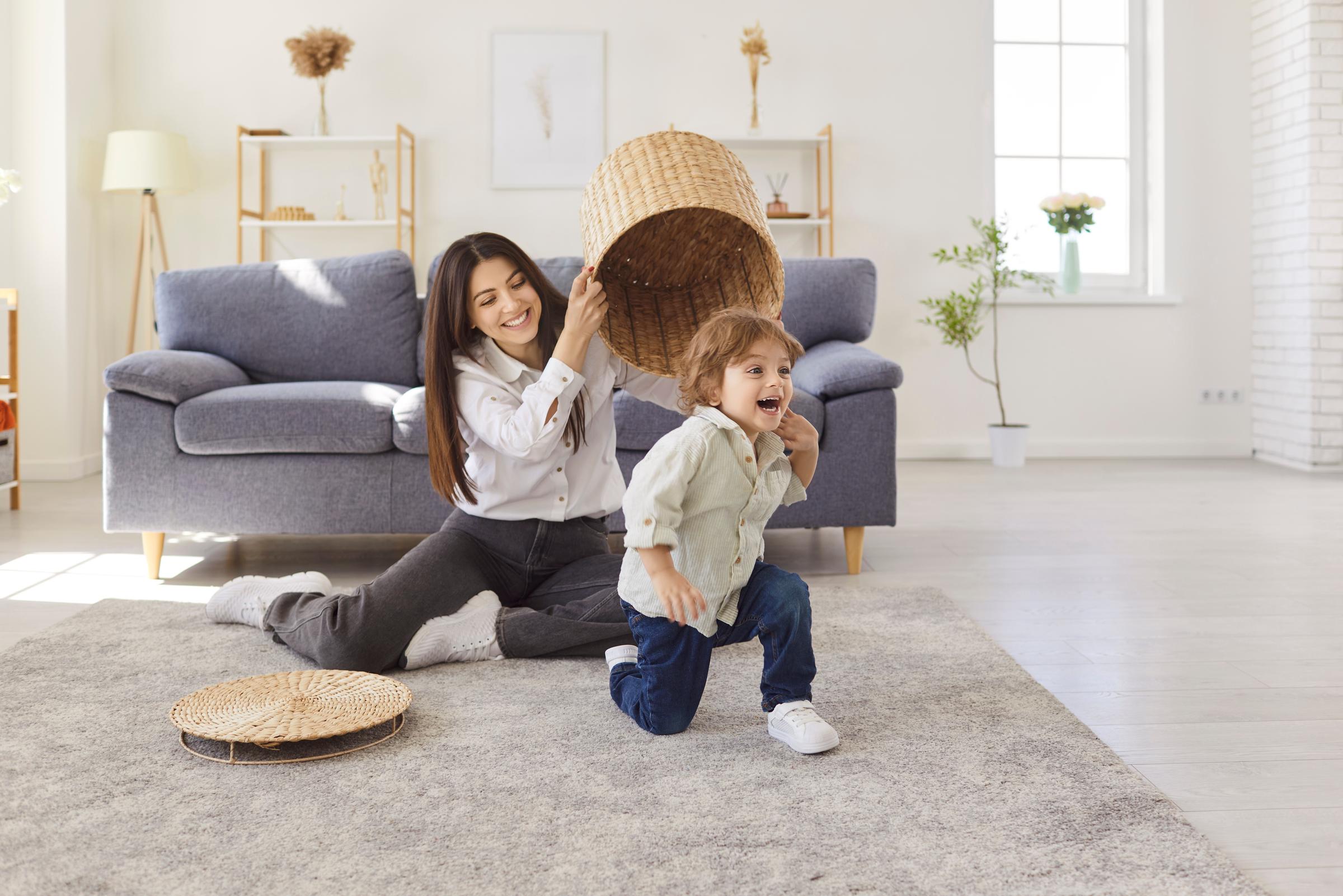 A woman and a young boy playing | Source: Shutterstock