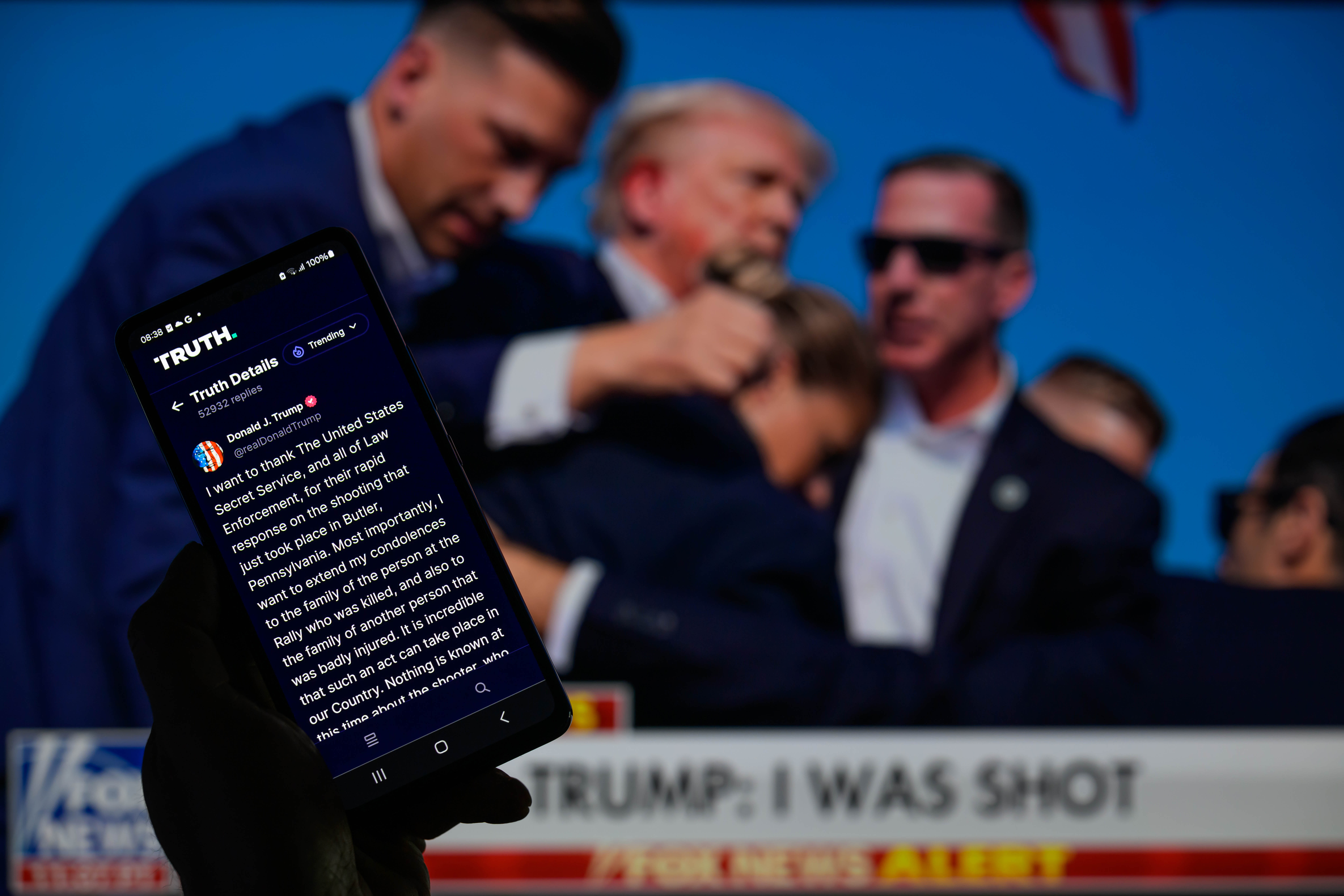 Donald Trump posts on his Truth Social account from the hospital after the Pennsylvania shooting in Brussels, Belgium, on July 14, 2024. | Source: Getty Images