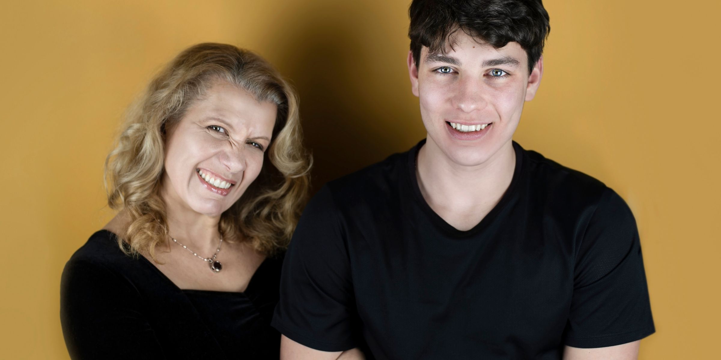 A young man with his mother | Source: Shutterstock