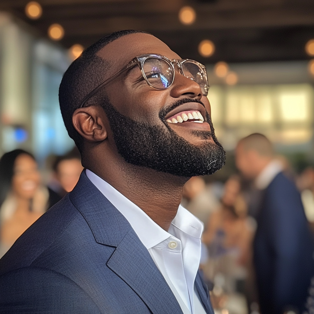 An amused man at a charity event | Source: No source