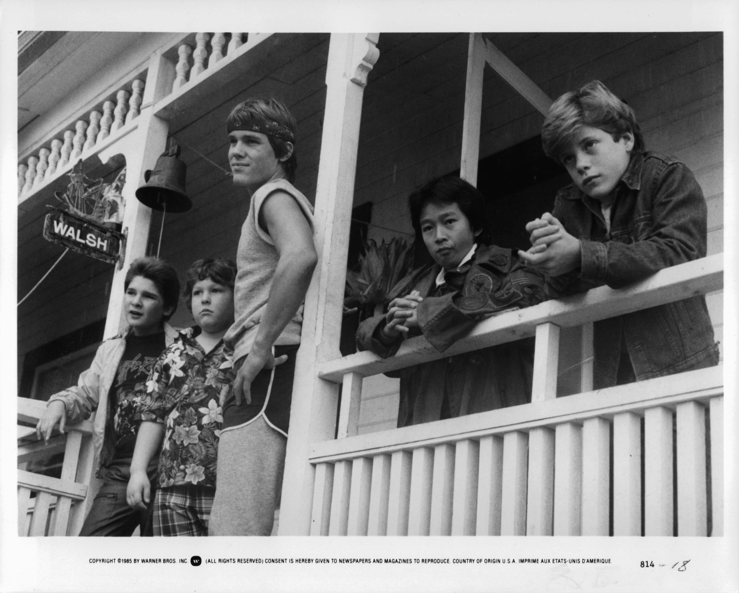 Corey Feldman, Jeff Cohen, Josh Brolin, Ke Huy Quan, and Sean Astin standing on the porch in a scene from the film "Goonies," in 1985 | Source: Getty Images