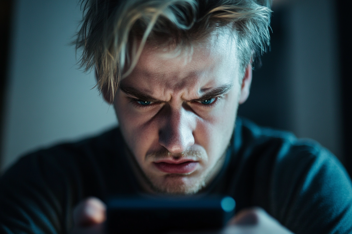 A man sending an angry text | Source: No source