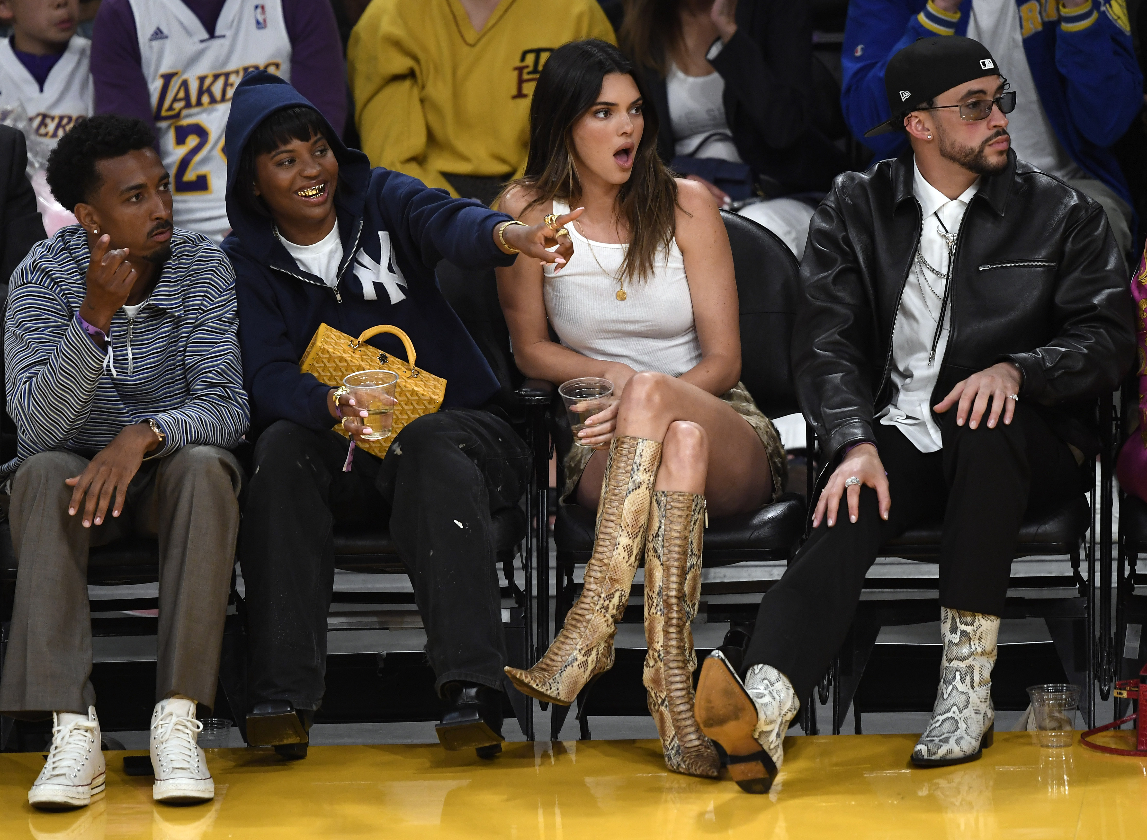 Yung Taco, Renell Medrano, Kendall Jenner, and Bad Bunny attend the Western Conference Semifinal Playoff game between the Los Angeles Lakers and Golden State Warriors on May 12, 2023 | Source: Getty Images