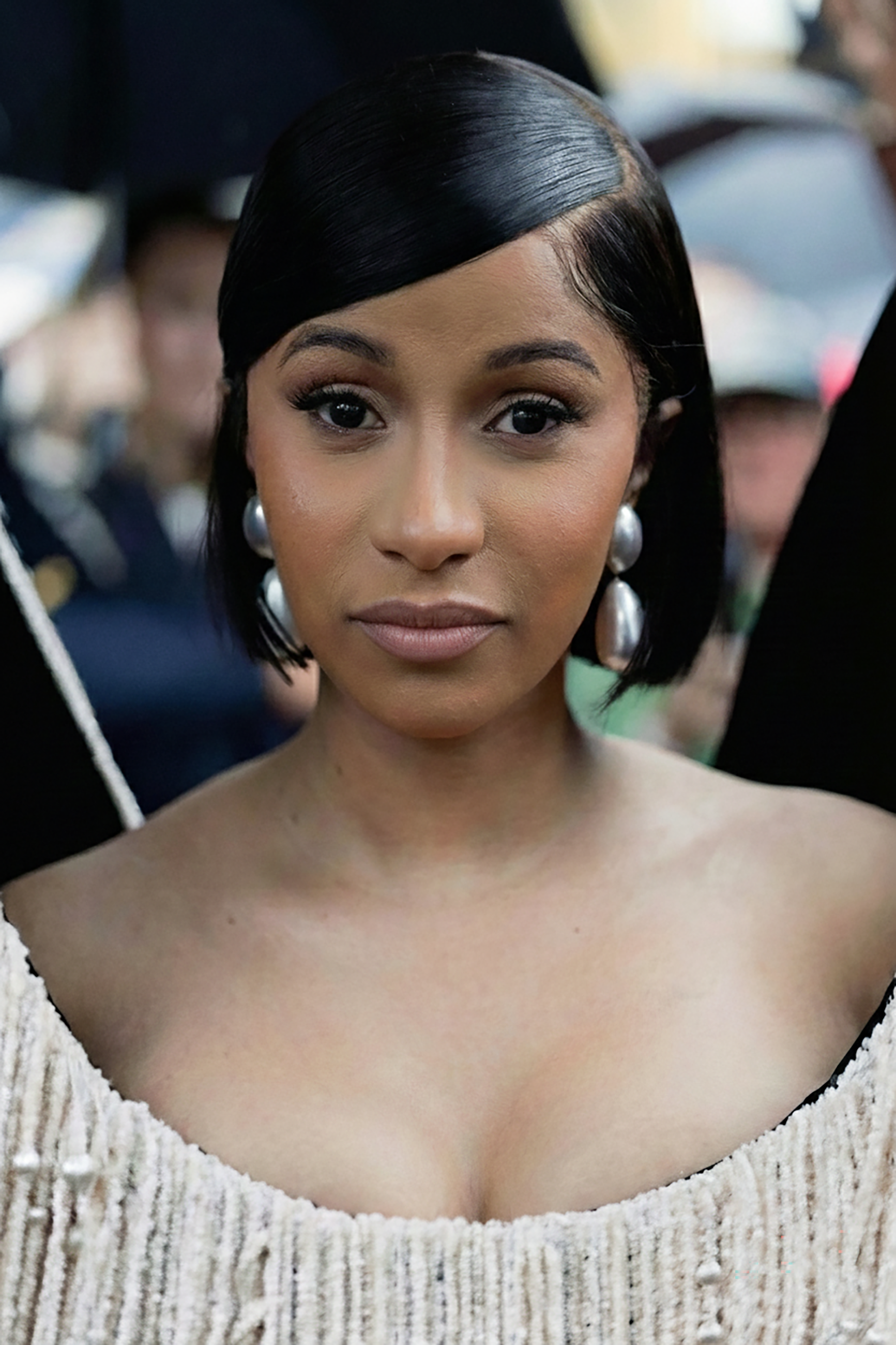 Cardi B as she might appear without cosmetic enhancements, based on AI generation via Gemini | Source: Gemini