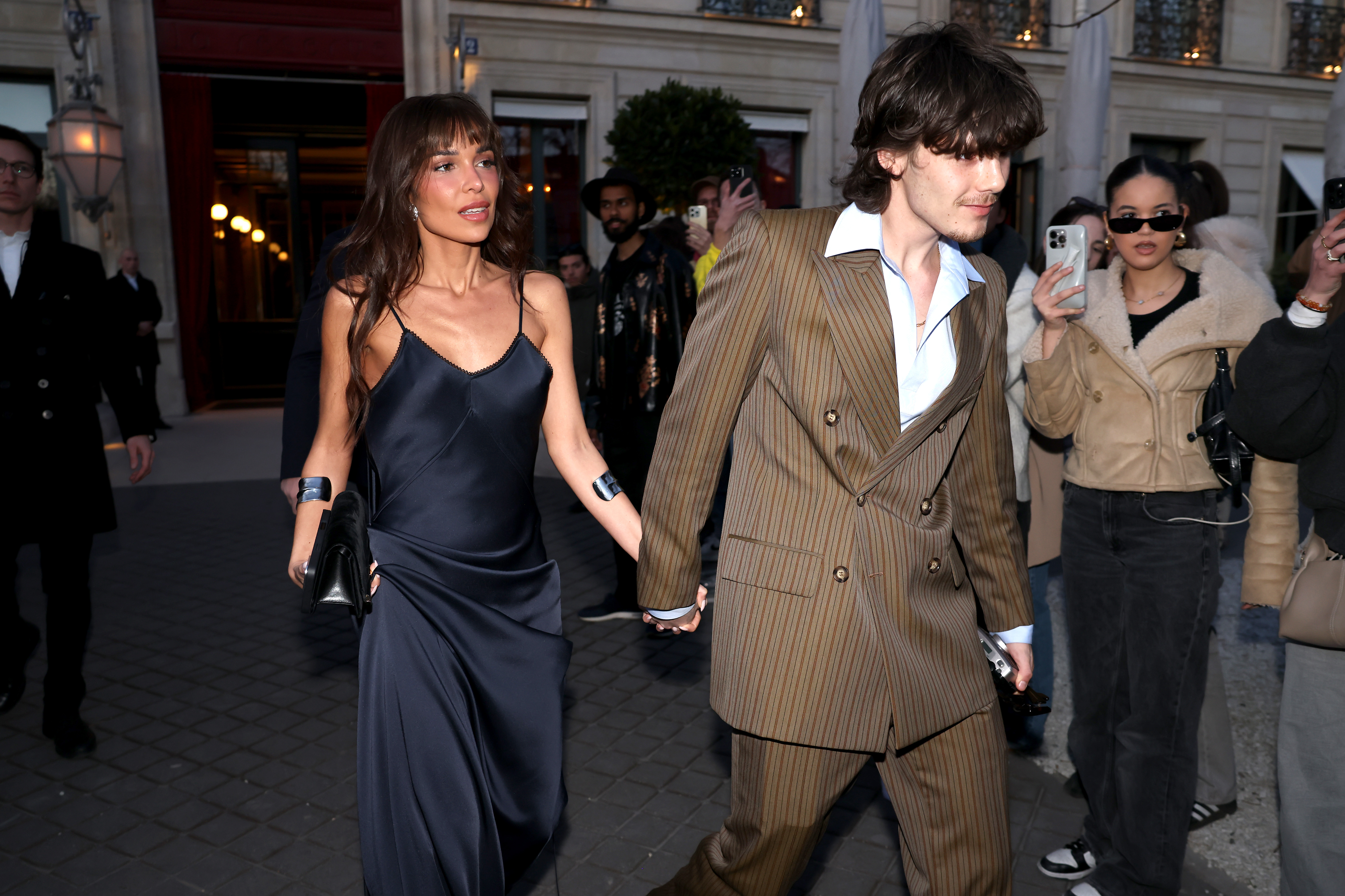 Jackie Apostel and Cruz Beckham are seen during the Paris Fashion Week on March 7, 2025 | Source: Getty Images