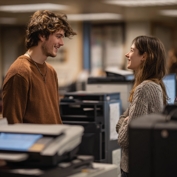 A man and a woman chatting at the library | Source: No source