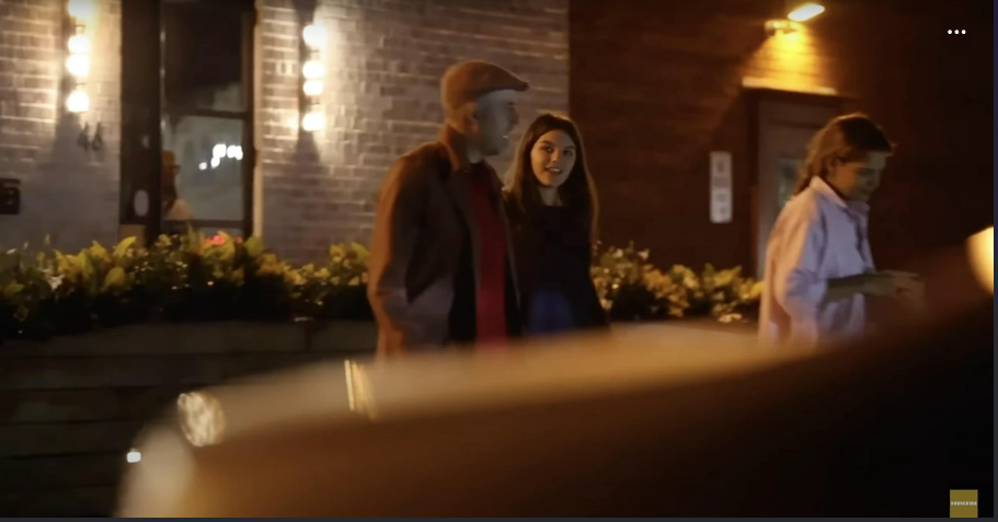 Under the warm city lights, Katie Holmes heads toward a taxi while Suri chats nearby with a smile. The night hums with quiet energy, capturing a fleeting moment between mother and daughter. It’s a glimpse of ordinary life touched by tenderness and calm connection. | Source: YouTube/PageSix