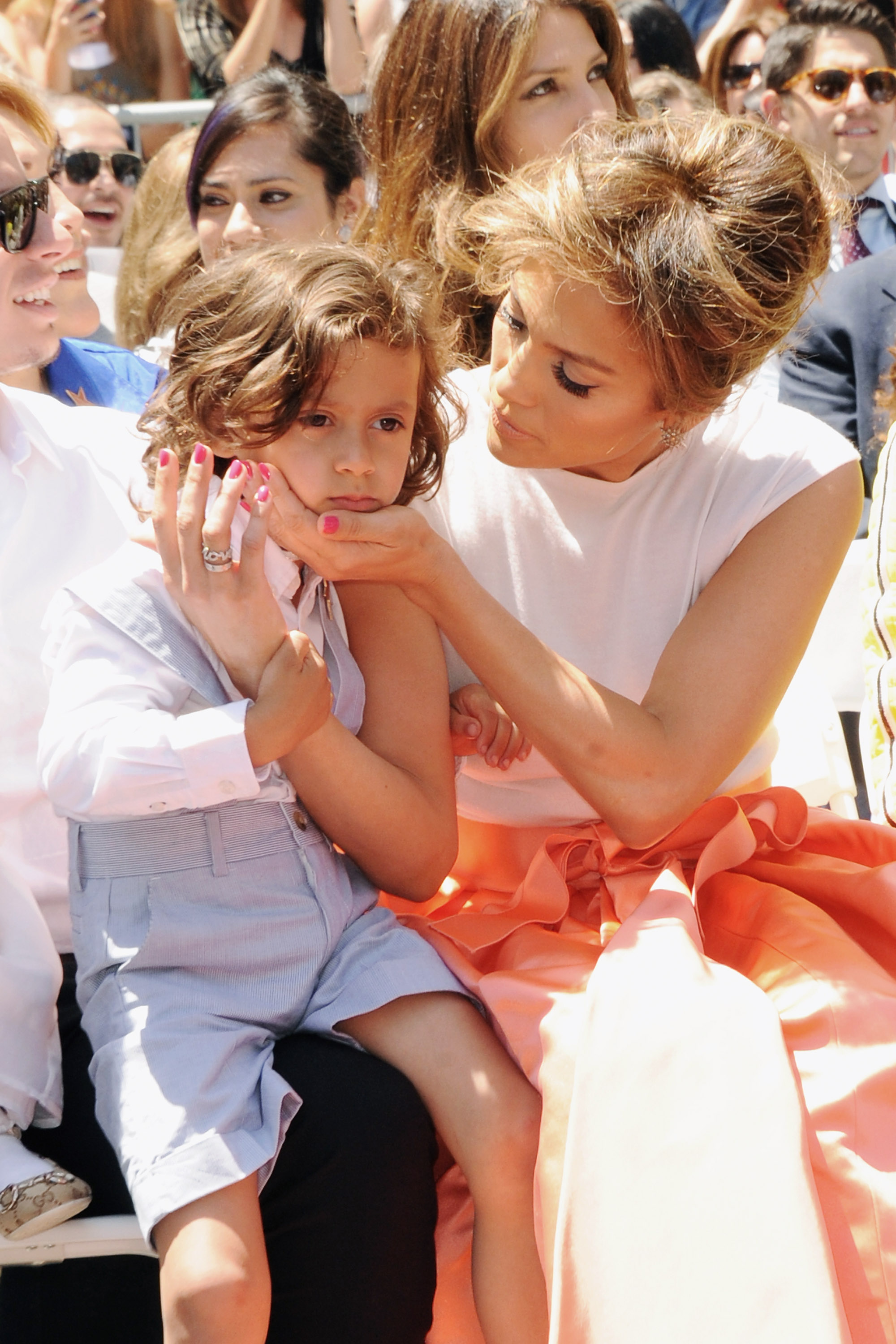 Maximilian Muniz with Jennifer Lopez as she is honored with a star on the Hollywood Walk of Fame on June 20, 2013 | Source: Getty Images
