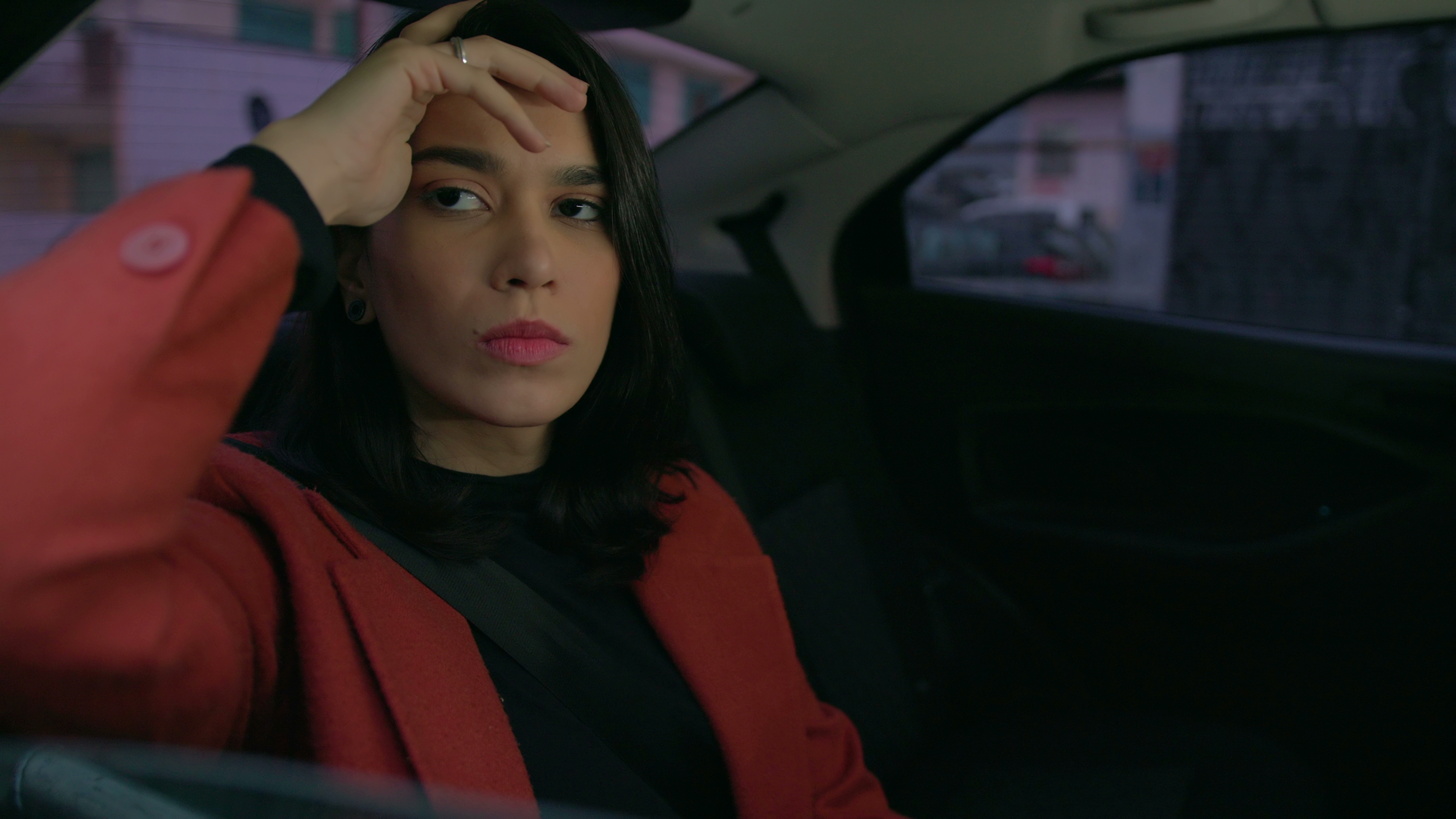 Girl is sitting on the backseat in the car | Source: Shutterstock