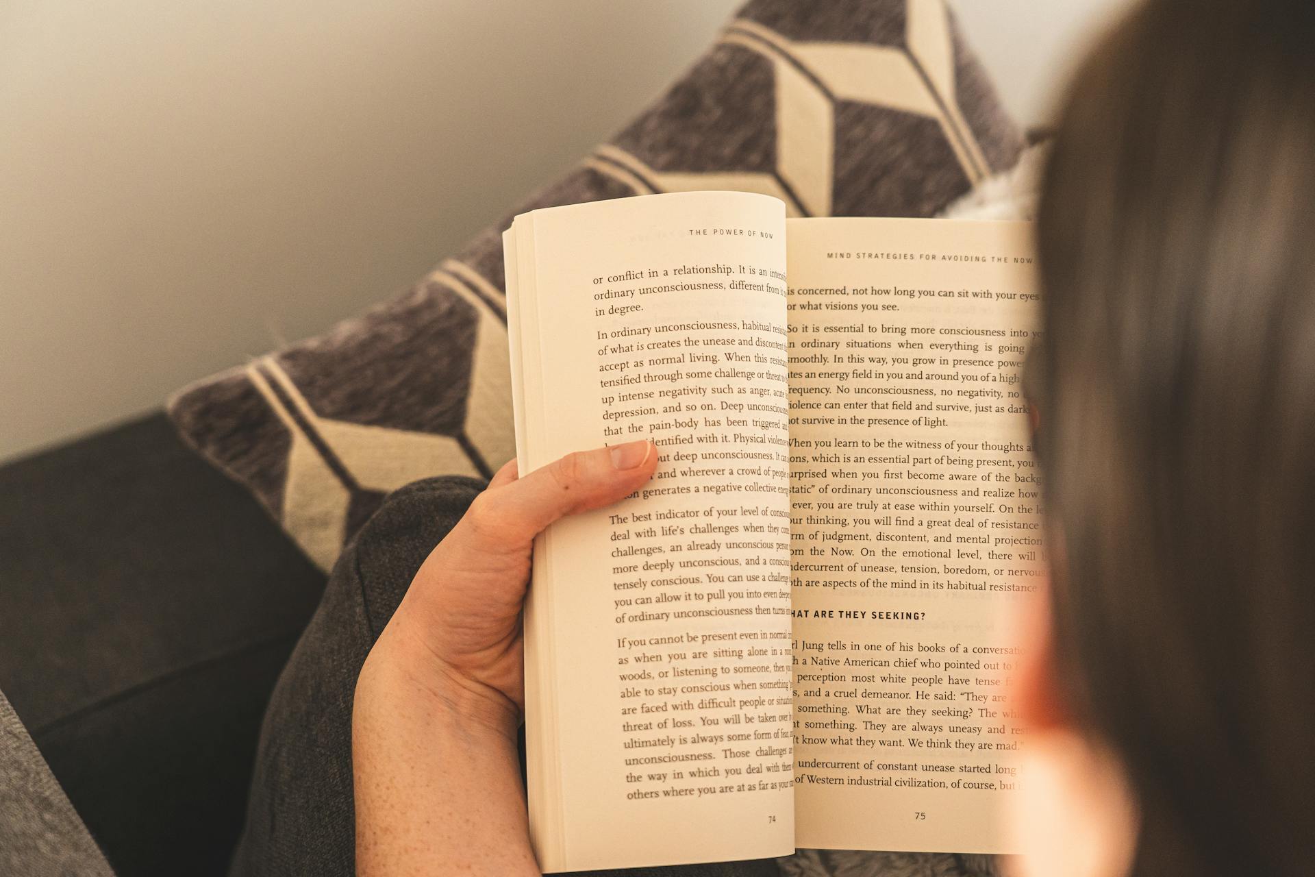 A girl reading a book | Source: No source