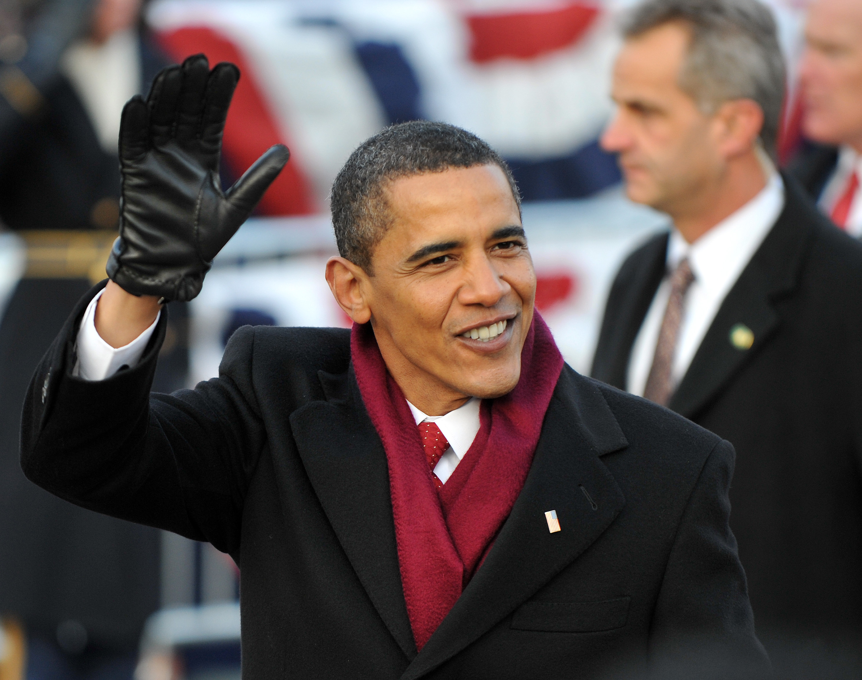 Former U.S. President Barack Obama waves during the Inaugural Parade in Washington, D.C., on January 20, 2009. | Source: Getty Images