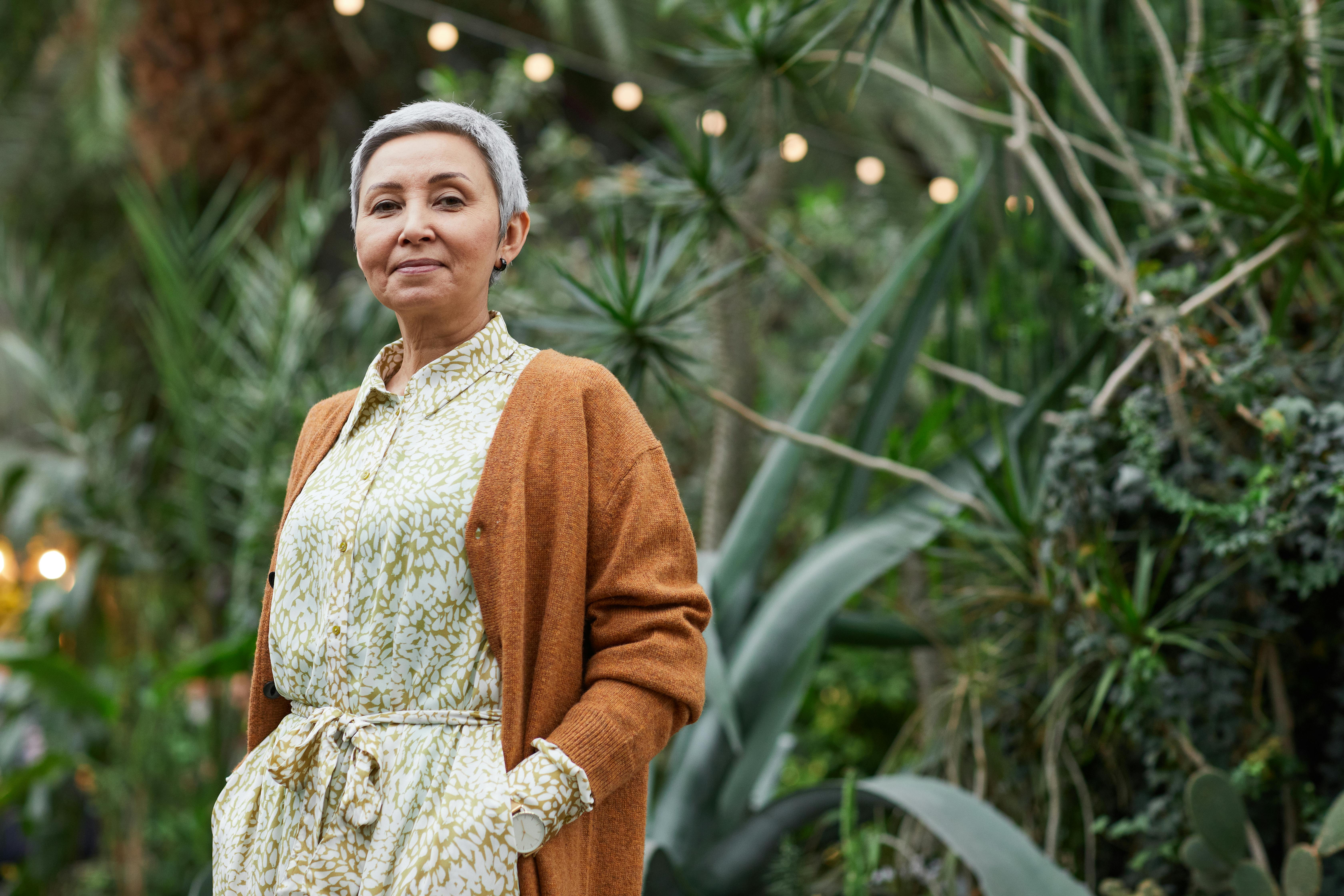 A smiling older woman standing outside | Source: Pexels