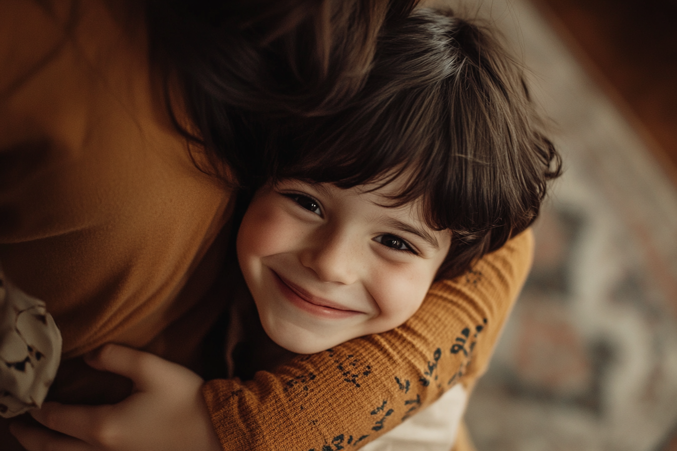 A woman hugging her son | Source: no source