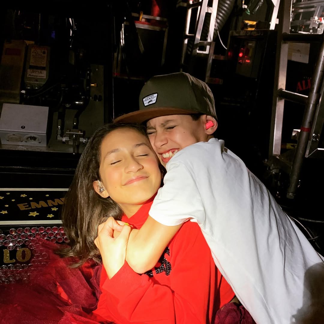 Emme and Maximilian Muniz pictured backstage during their mother's "It's My Party" tour dated July 8, 2019 | Source: Instagram/jlo