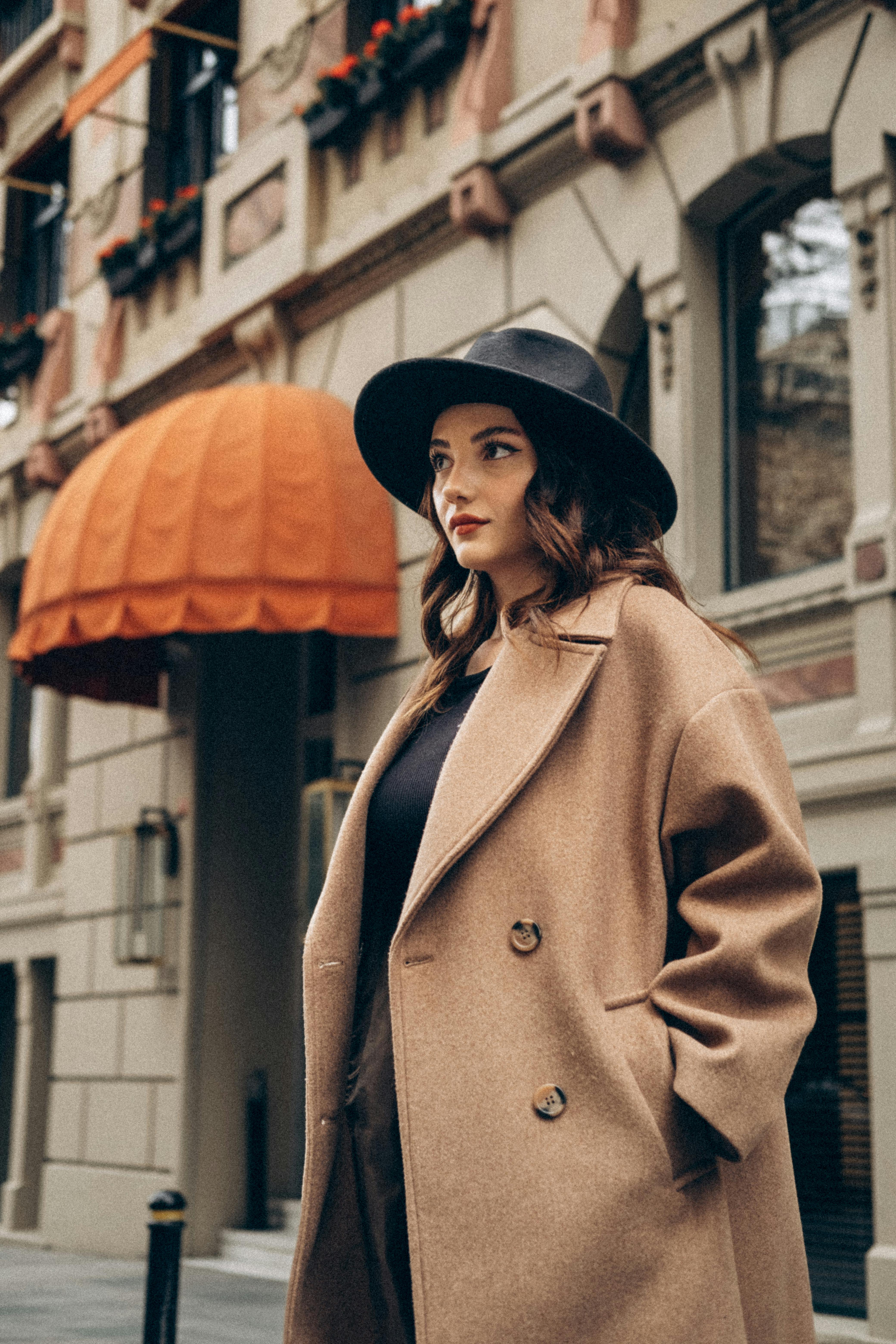 Stylish woman in a beige coat and hat | Source: Pexels