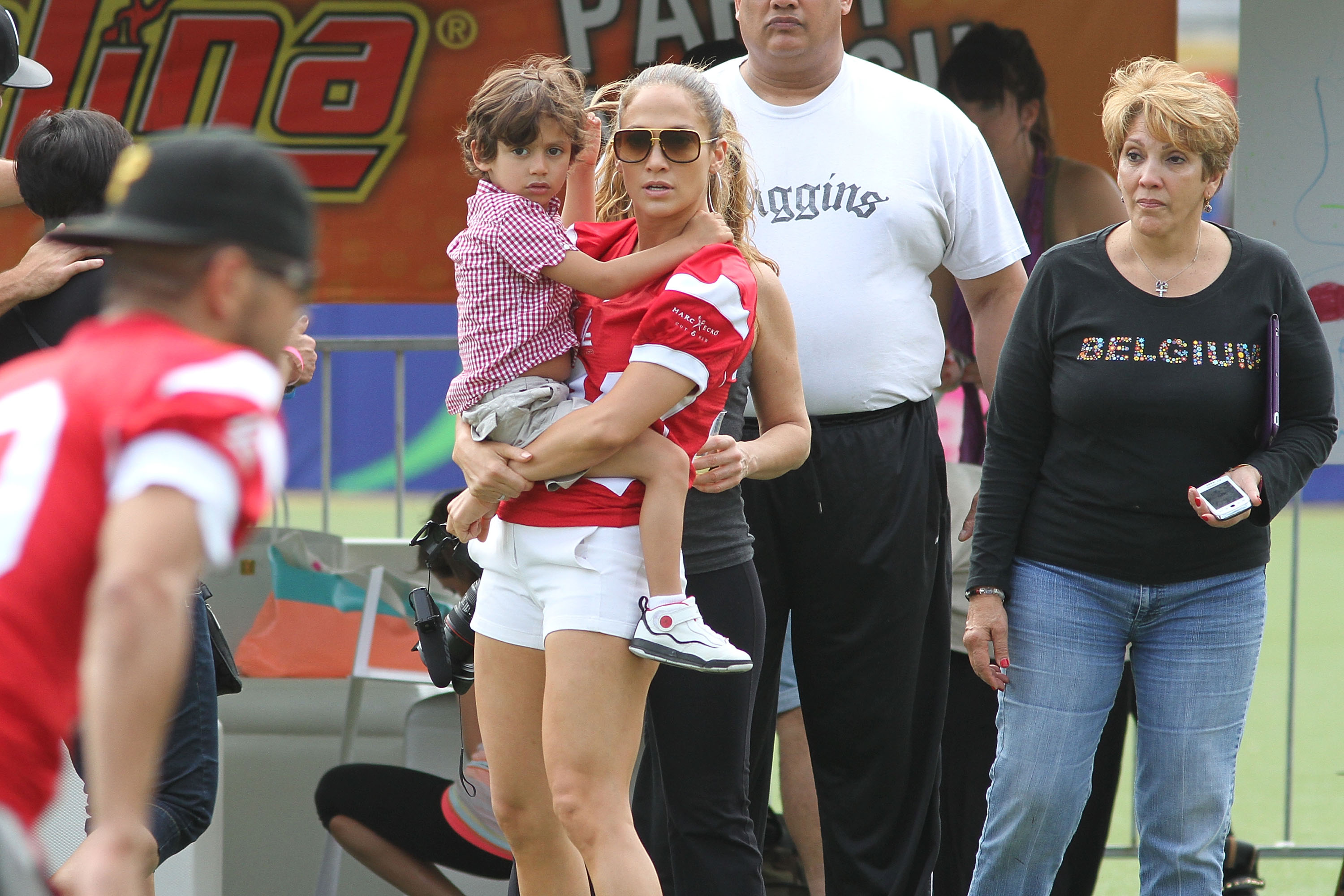 Jennifer Lopez with her son Maximilian David Muniz and her mother, Guadalupe Rodriguez attend the Pre-Concert Celebrity Football Game Benefiting Hurricane Sandy Relief on December 22, 2012 | Source: Getty Images