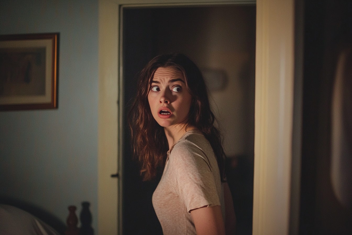 A woman standing in a doorway | Source: no source