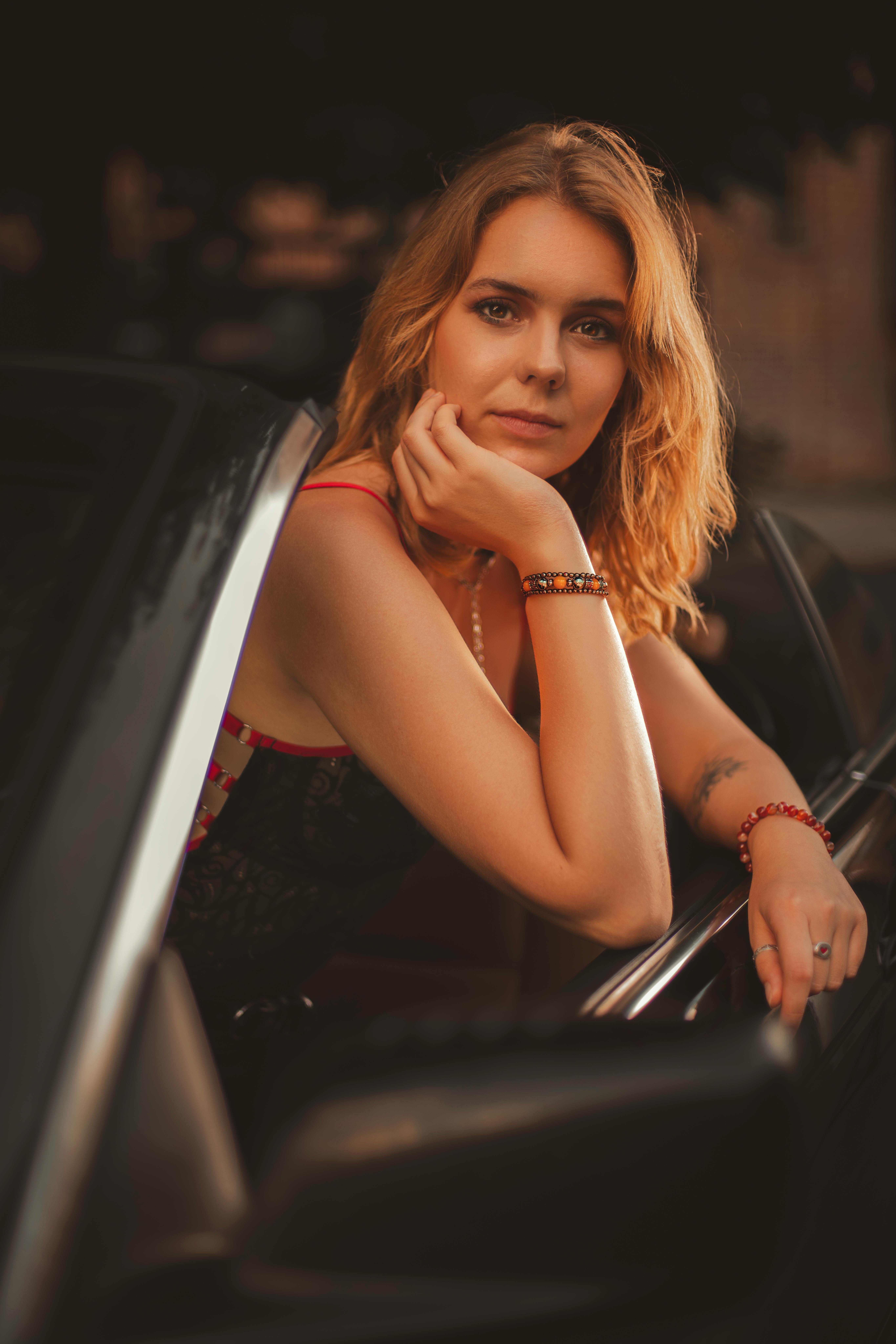 Woman in car at golden hour