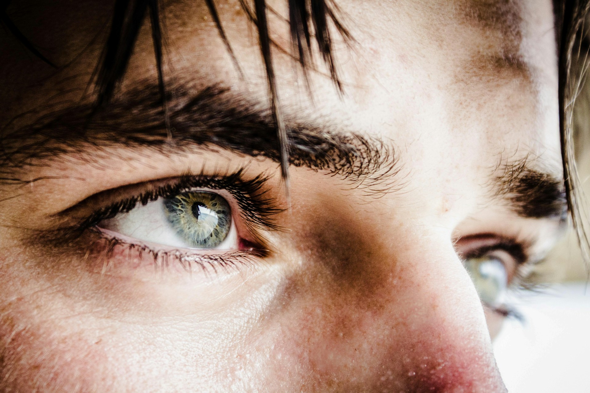 A sad young boy's eyes bearing the weight of hurt and disappointment | Source: Unsplash