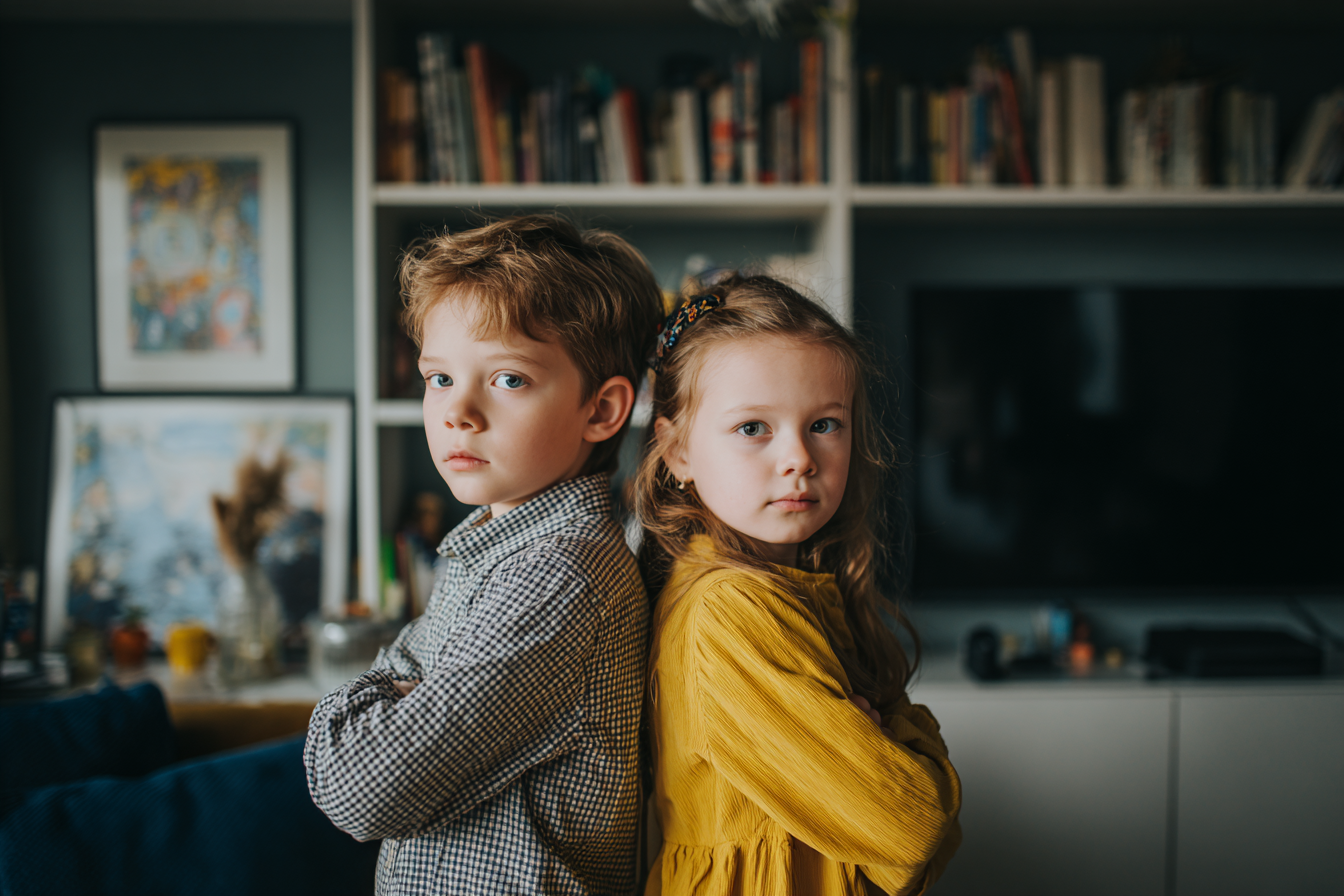 Two kids standing together | Source: No source