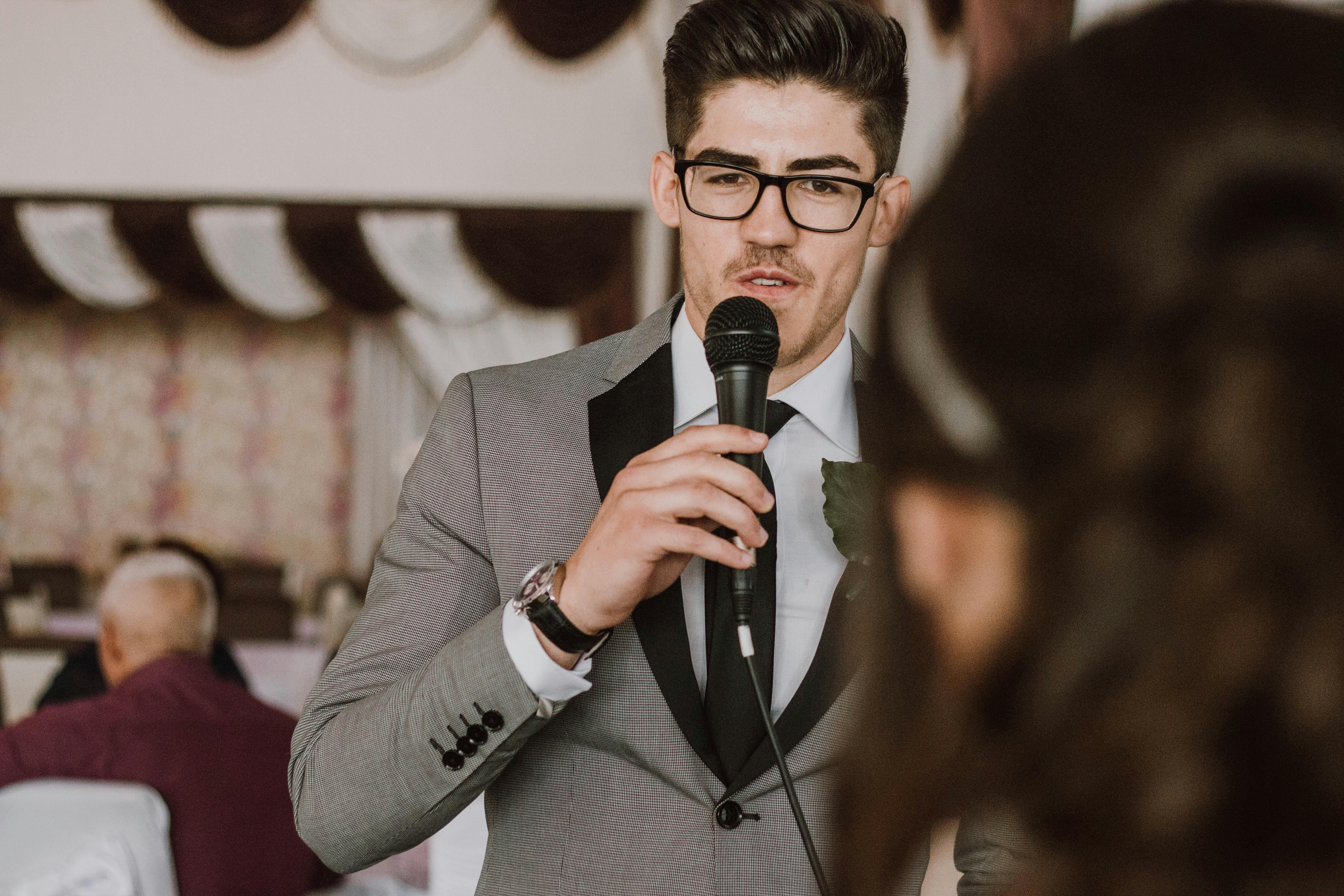 A serious man speaking on a mic | Source: Pexels