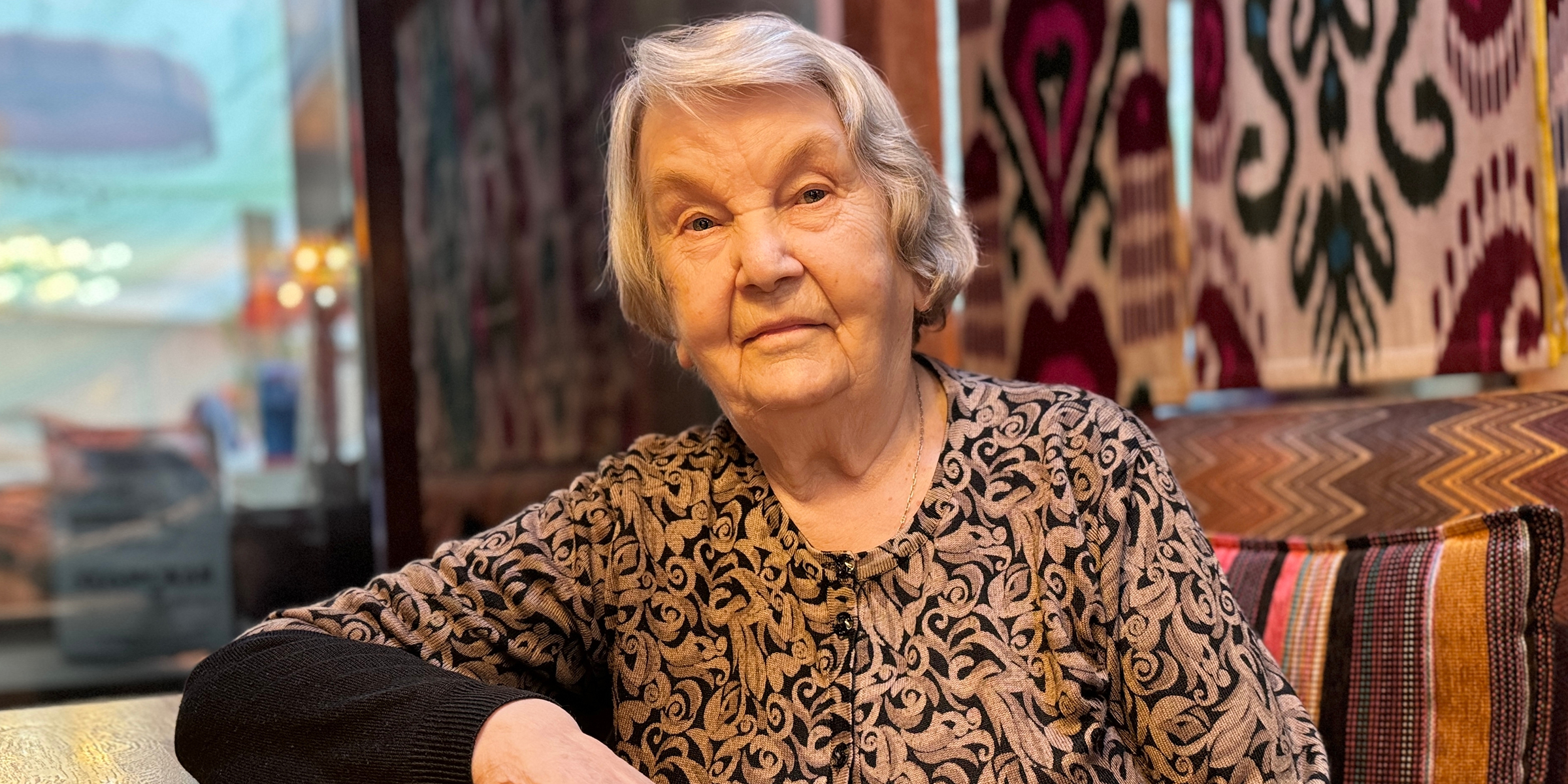 An elderly woman in a restaurant | Source: No source