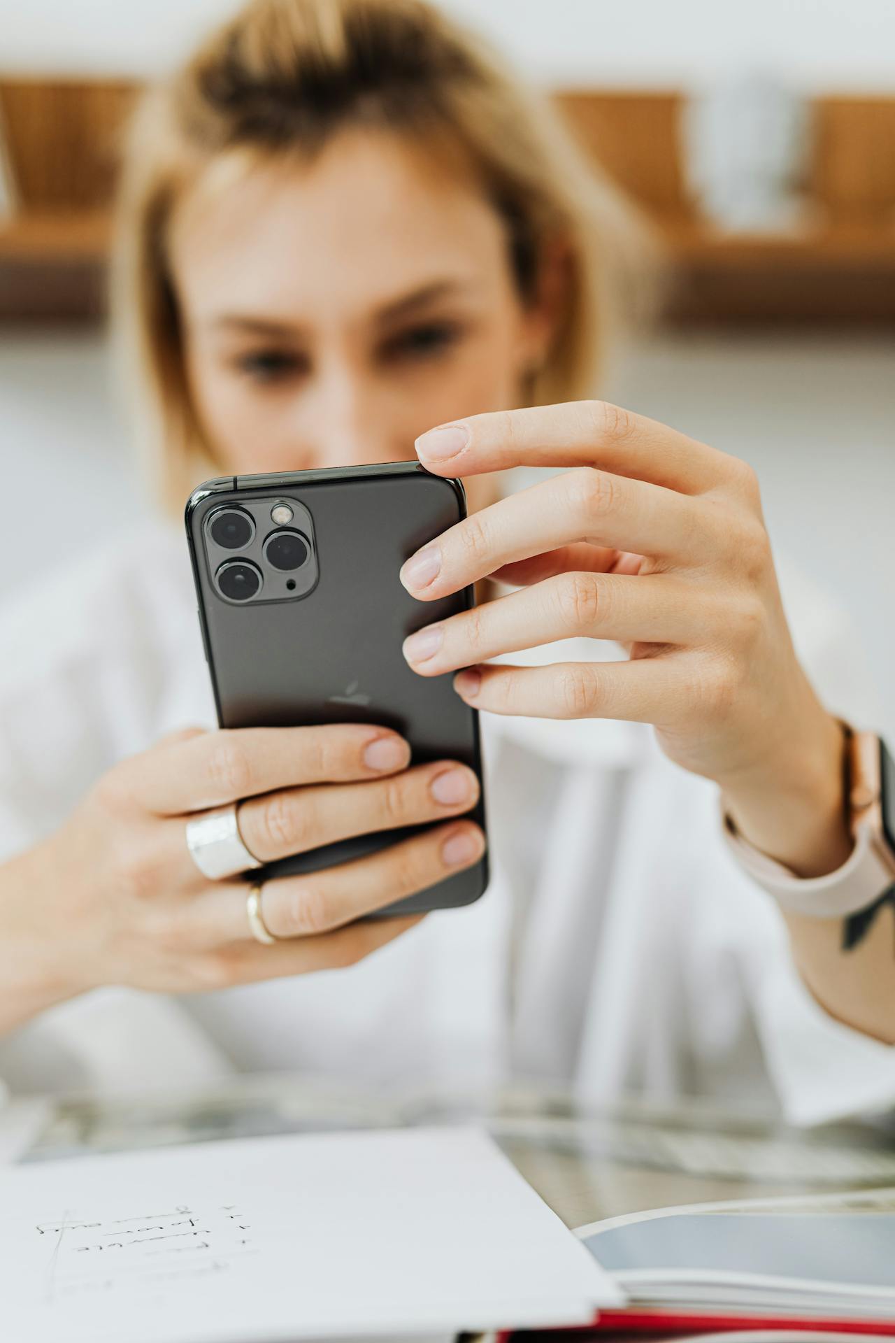 A woman looking at her phone | Source: Pexels