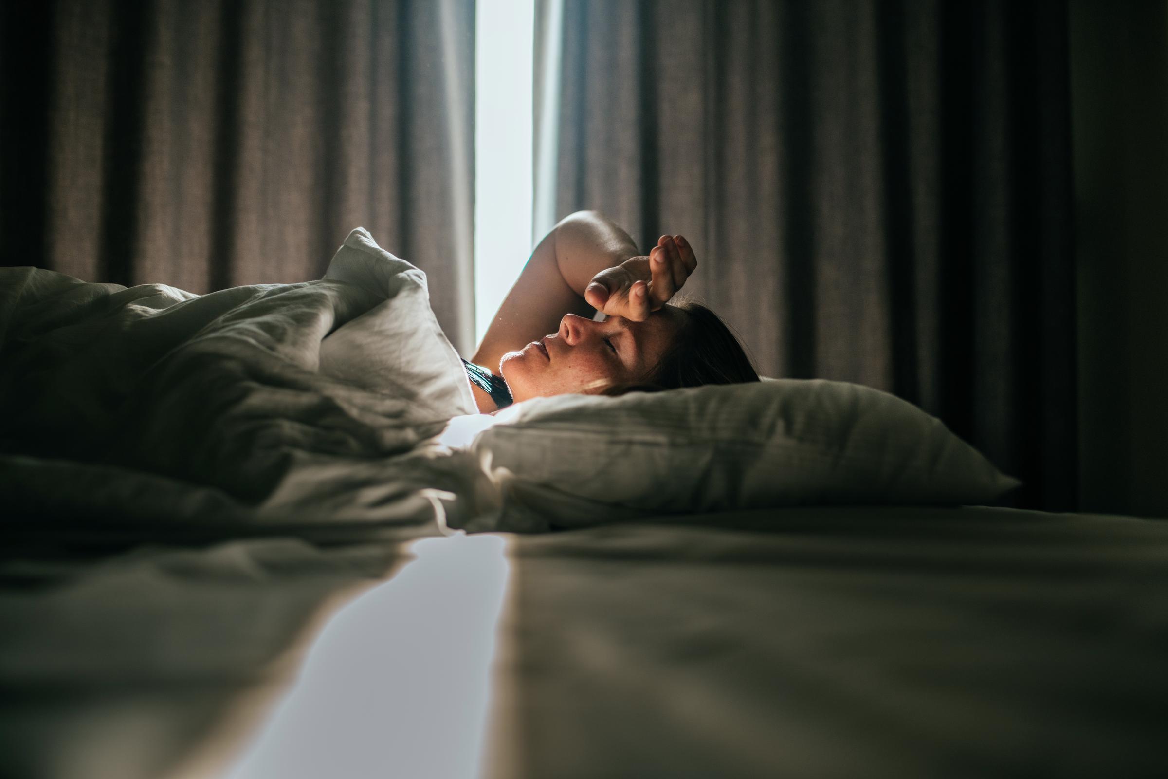 A woman waking up from sleep | Source: Getty Images
