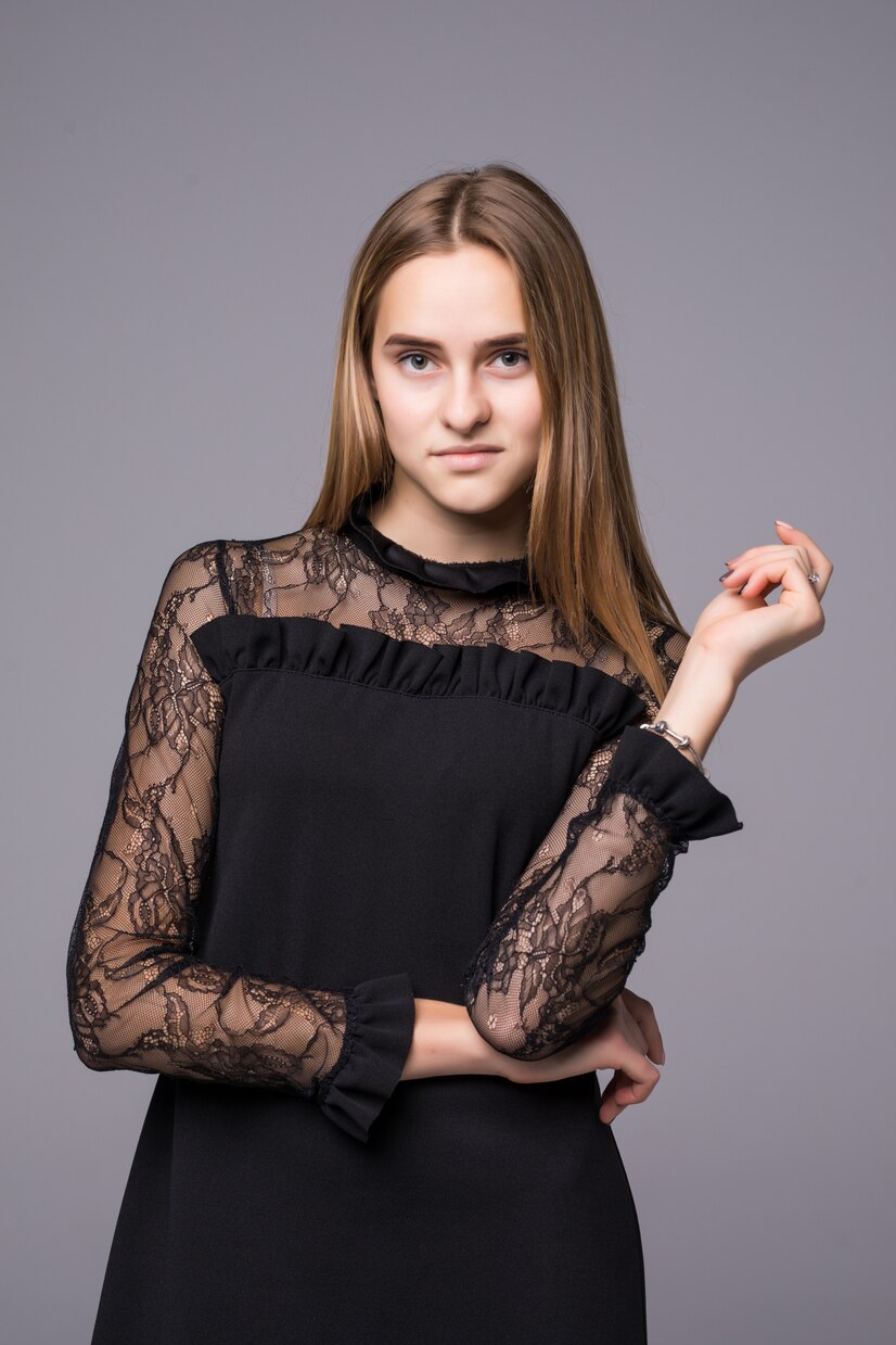 A confident woman in a black dress | Source: Pexels