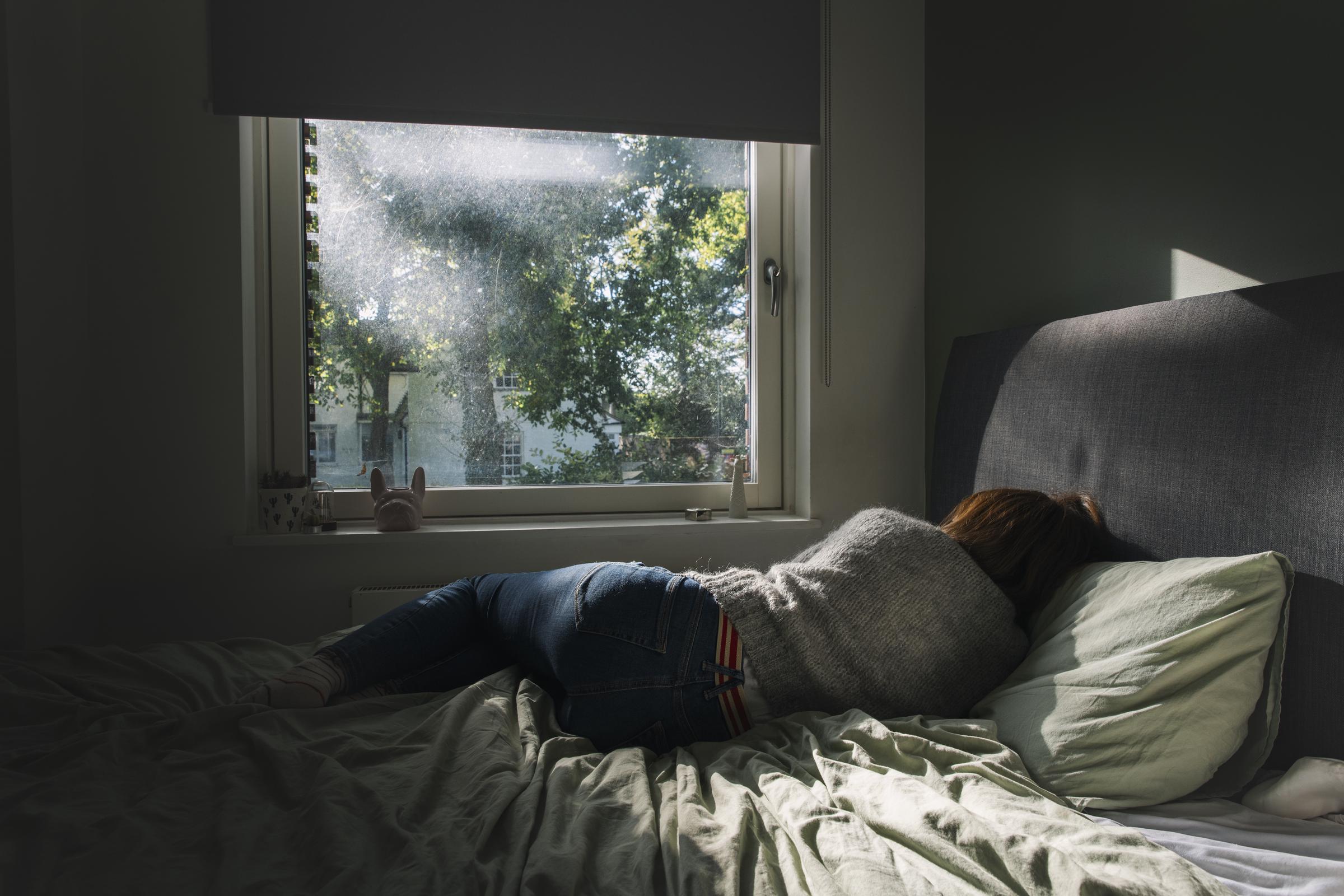 A woman laying in her bed | Source: Getty Images