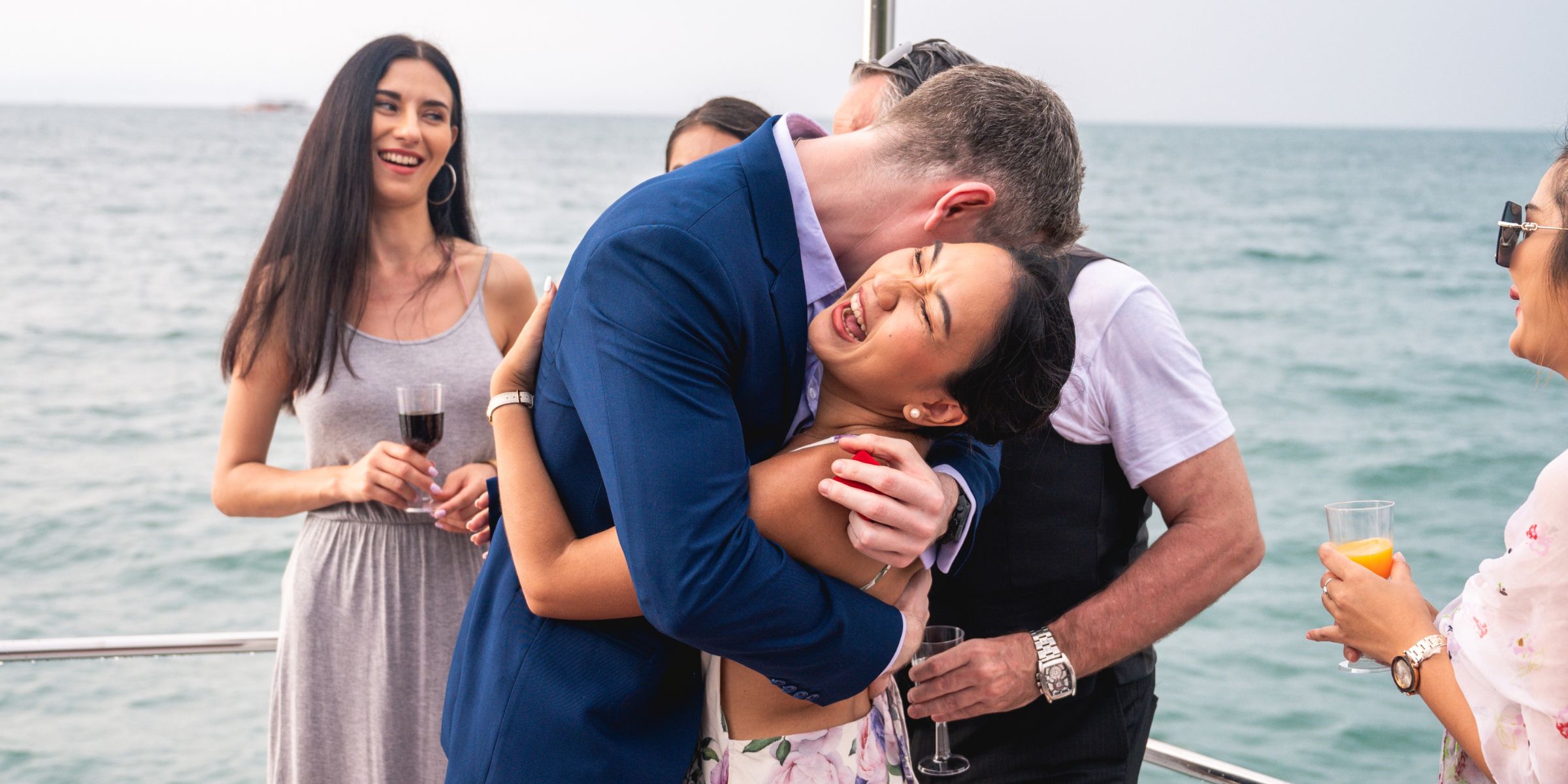 A young couple hugging on a yacht | Source: Shutterstock