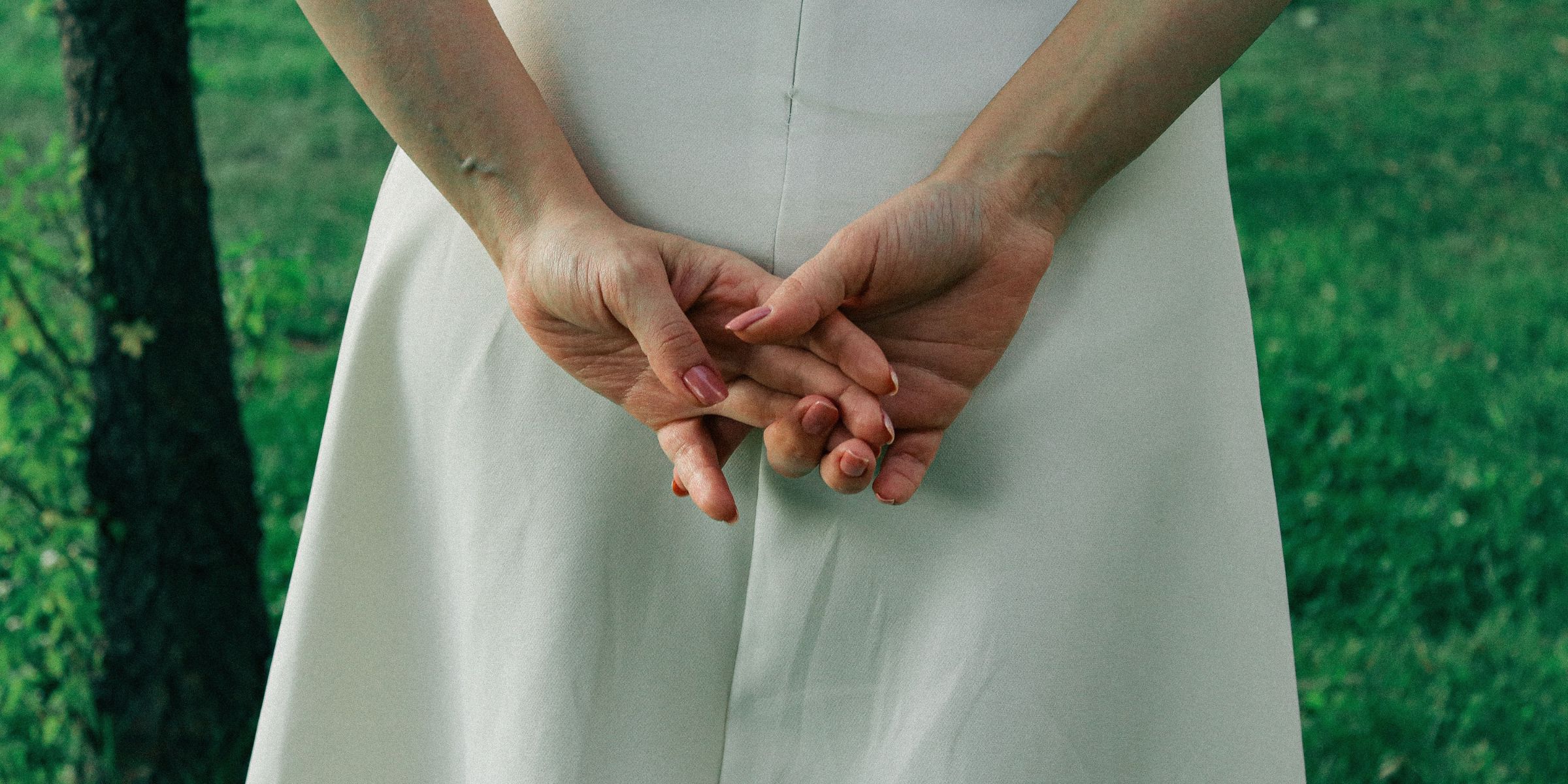 A person standing with their hands behind their back | Source: Pexels