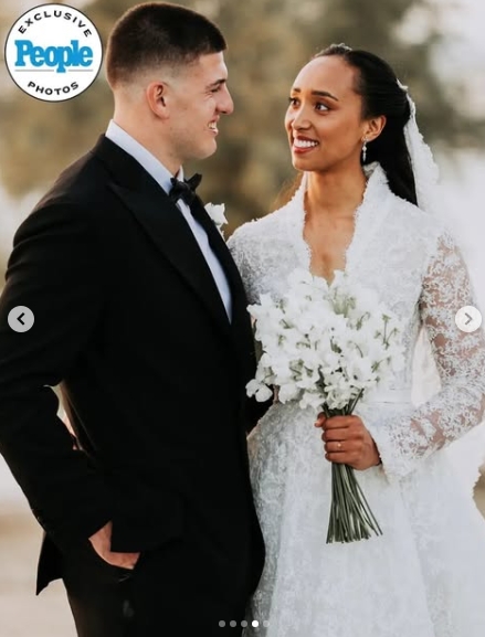 George Karlaftis and Kaia Harris smiled at one another while posing for portraits on their wedding day. | Source: Instagram/people
