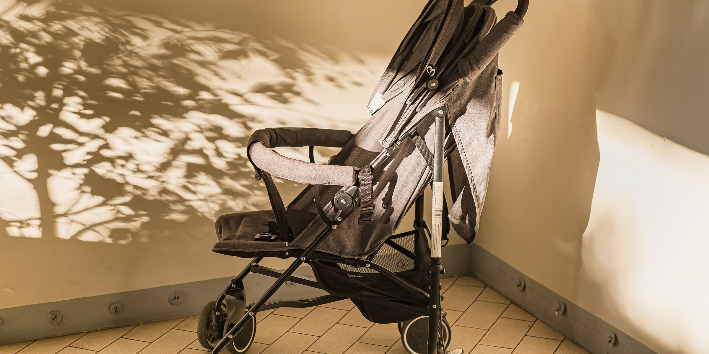 A baby stroller in the corner of a room | Source: Shutterstock