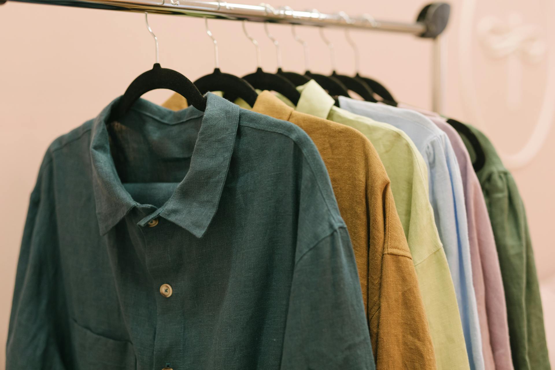 Clothes hanging on a rack | Source: No source