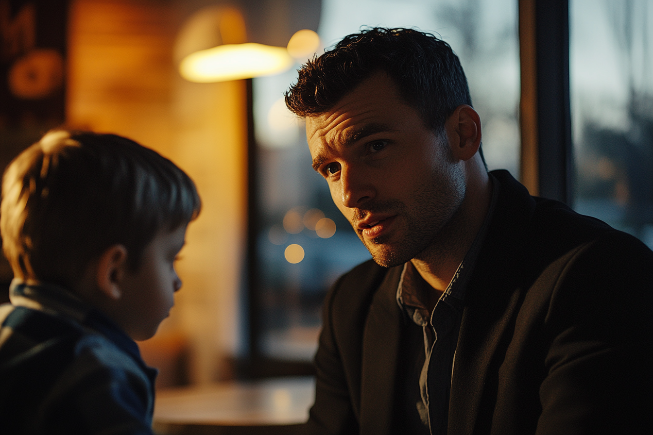 A man talking to a child | Source: No source