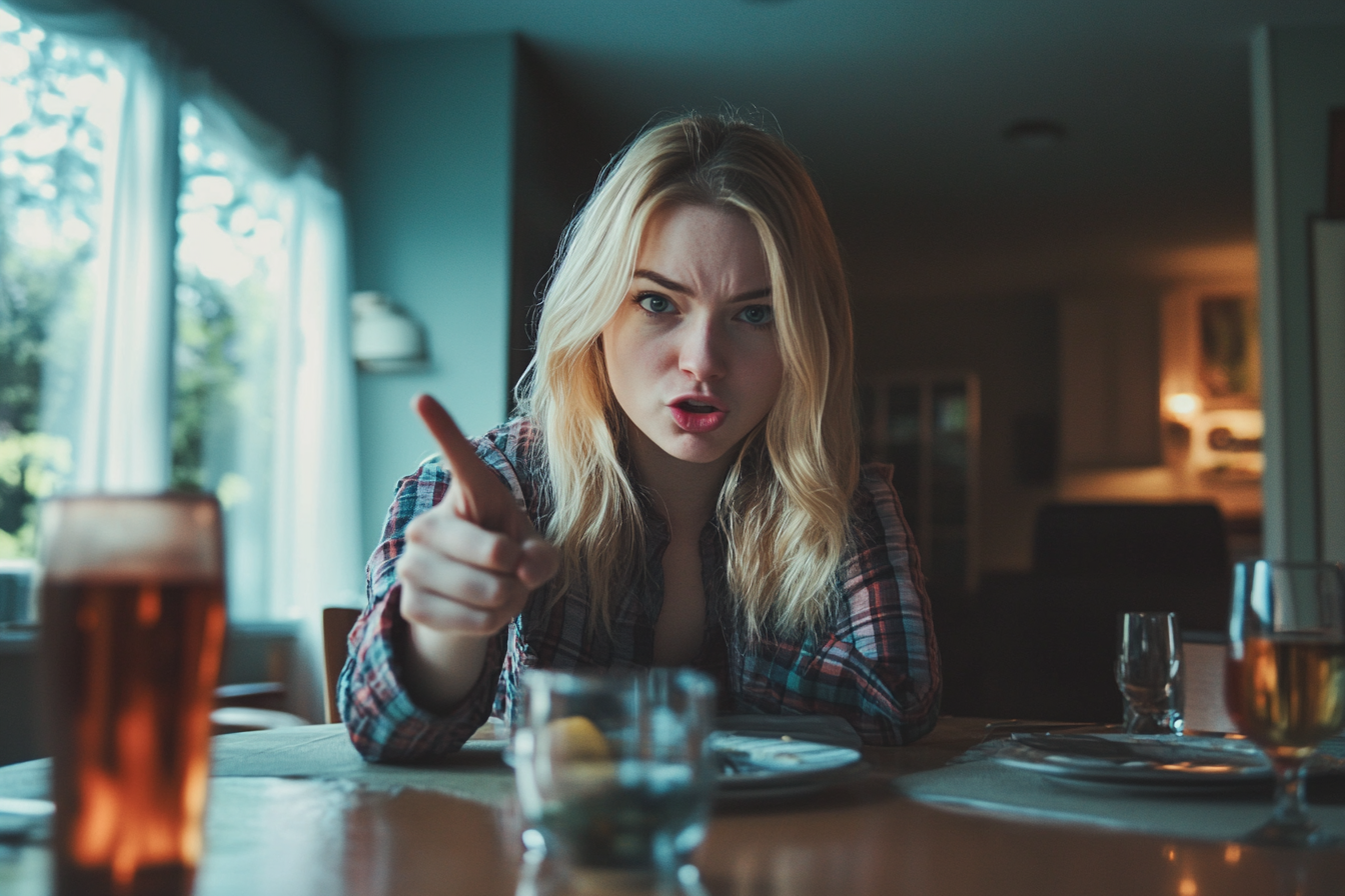 A woman pointing at someone while speaking angrily | Source: No source