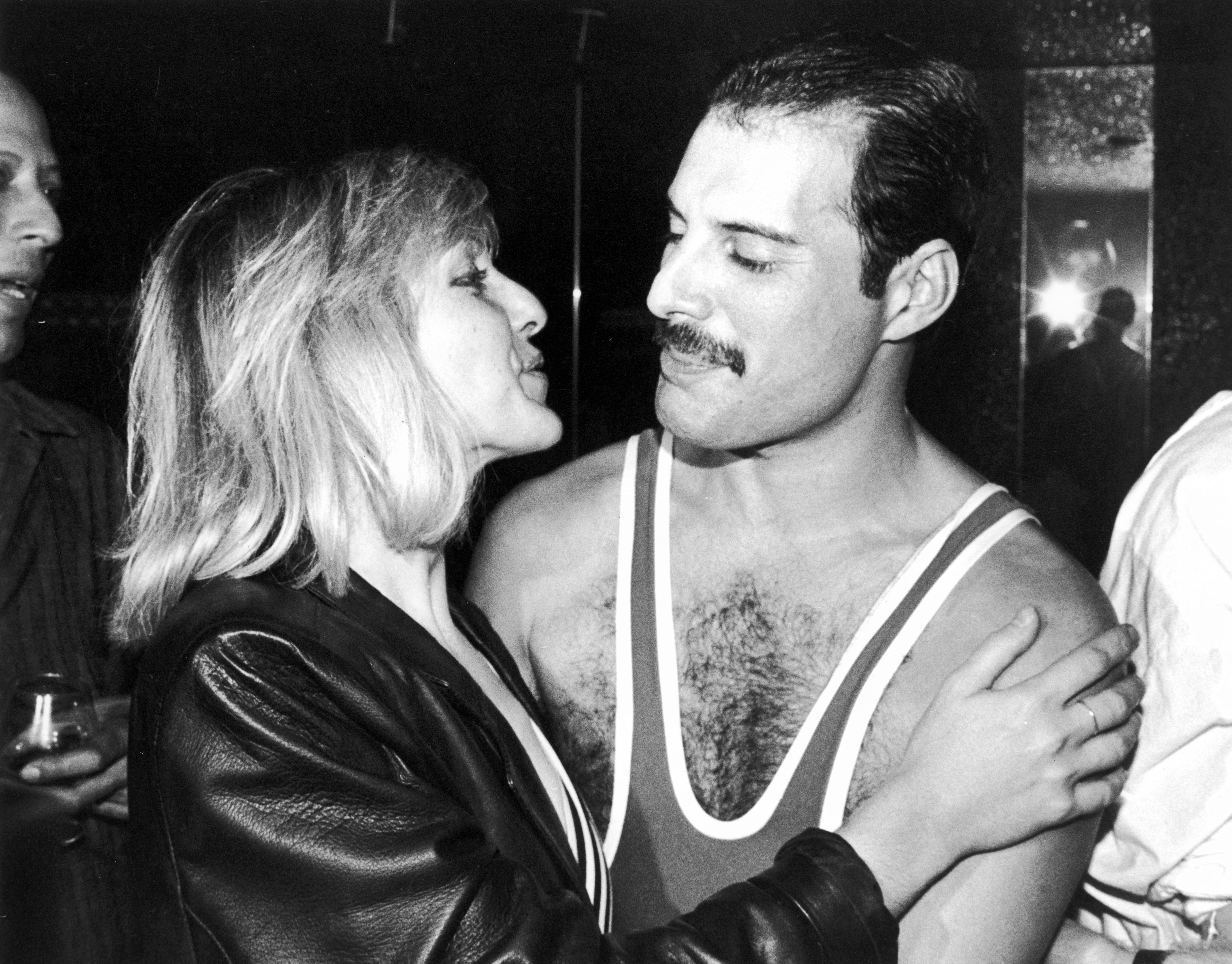 Freddie Mercury (1946 - 1991) and Mary Austin are pictured during Mercury's 38th birthday party at the Xenon nightclub in September 1984 in London. | Source: Getty Images