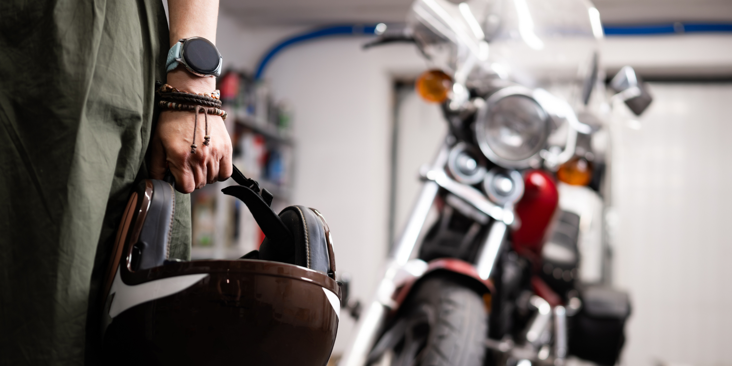 A biker holding his helmet | Source: Shutterstock
