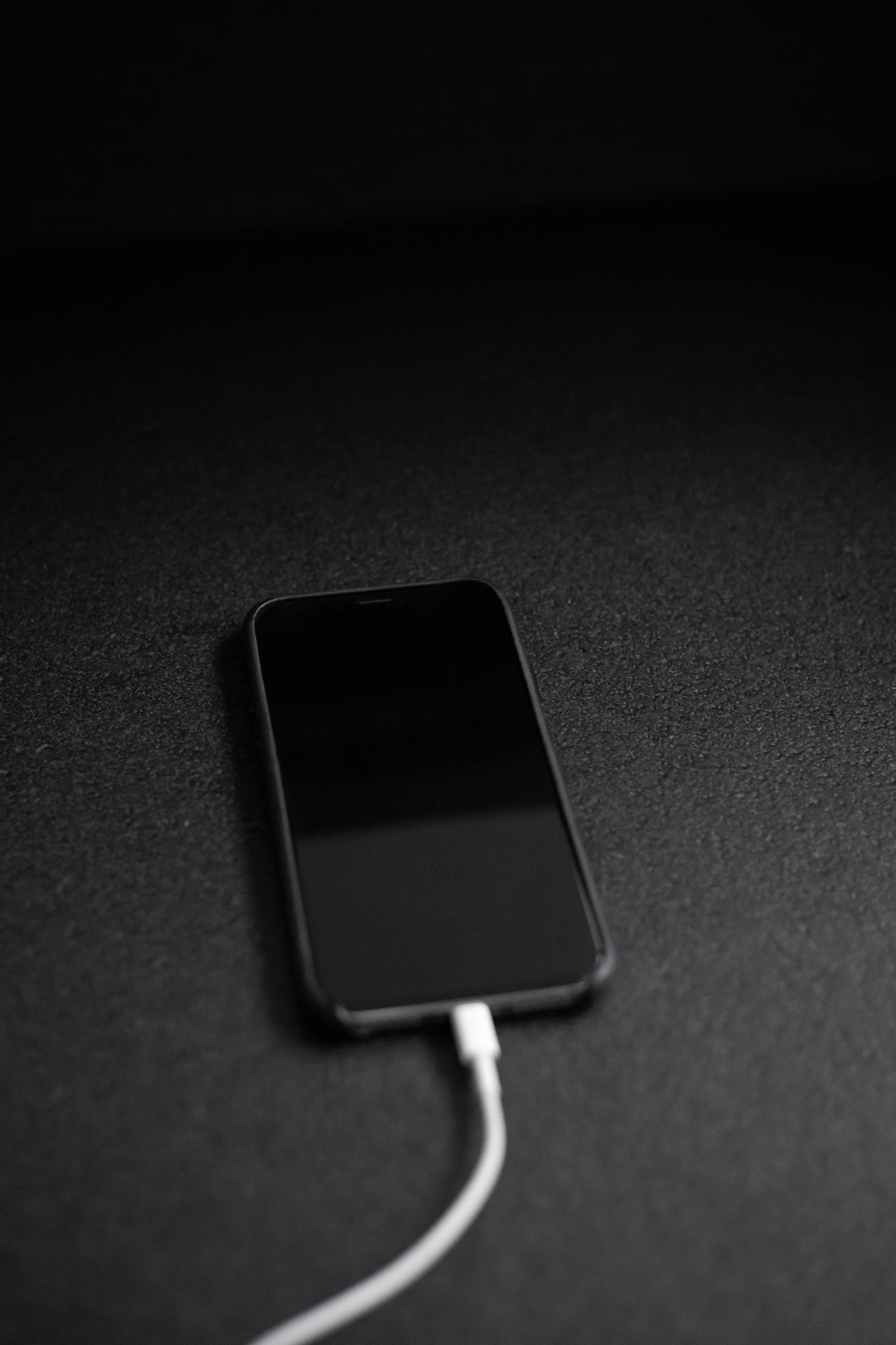 A phone plugged to the charger | Source: Unsplash