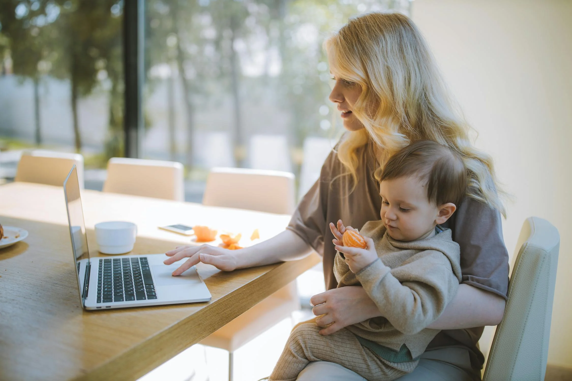 A woman holding her young son | Source: Pexels