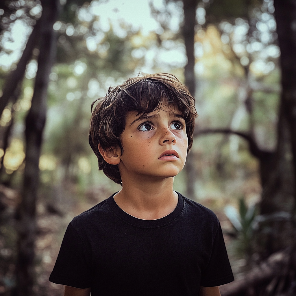 A boy in the woods | Source: No source