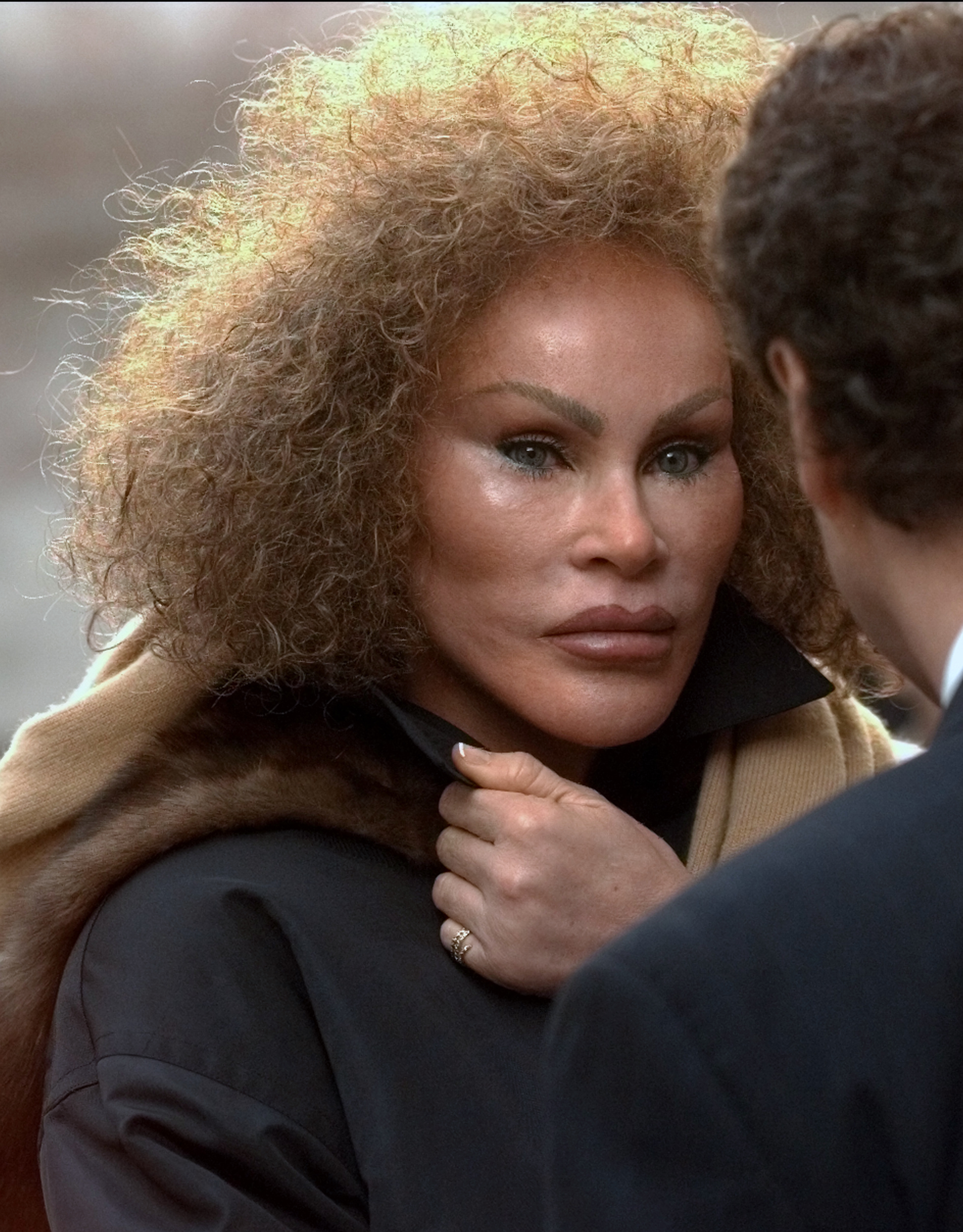 Jocelyne Wildenstein's face was characterized by taut, smooth skin, extremely prominent high cheekbones, and distinctive slanted "cat-eyes," as she left the NY State Supreme Court on December 17, 1997, in New York.