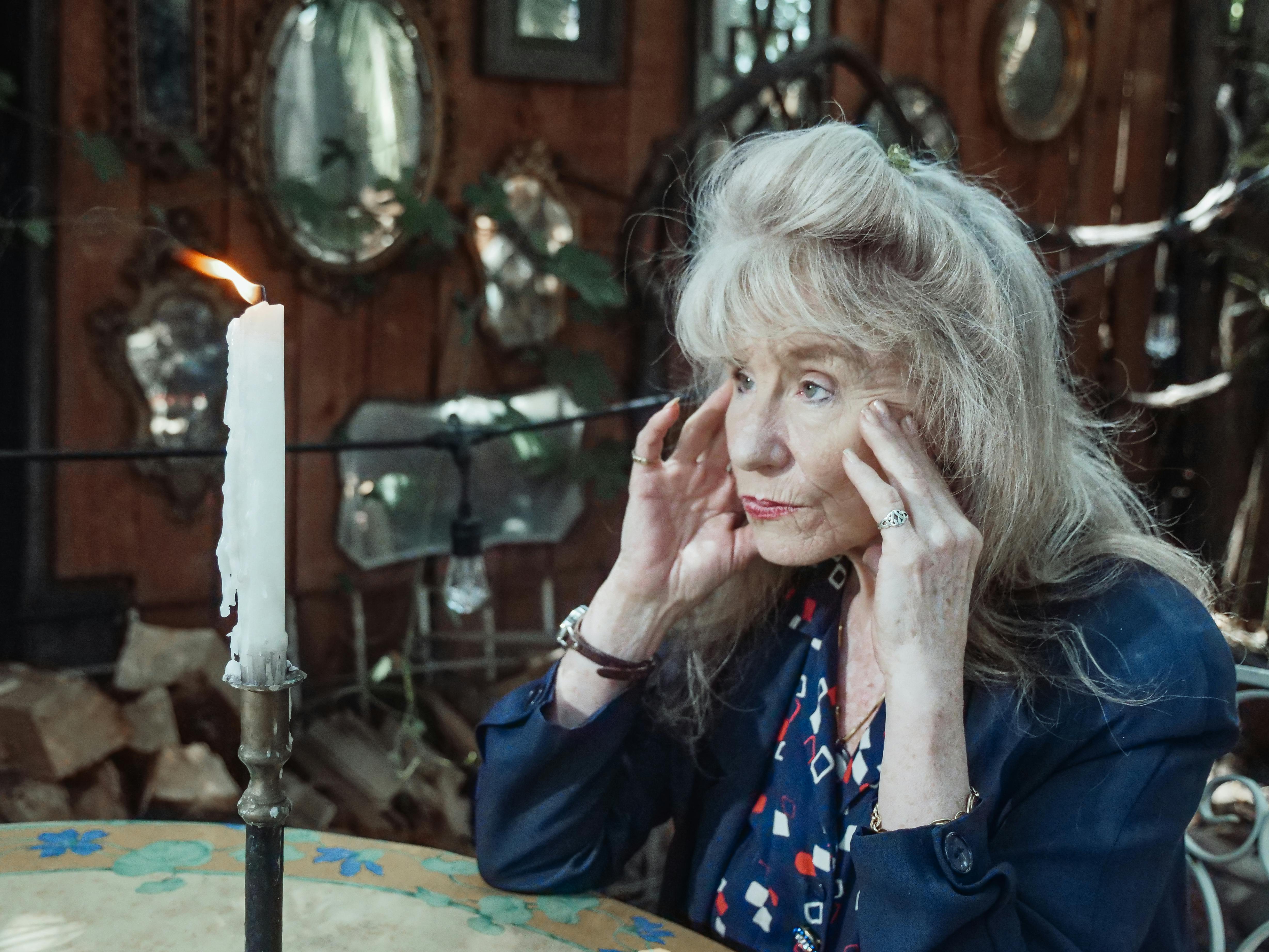 A senior woman lost in thoughts | Source: Pexels