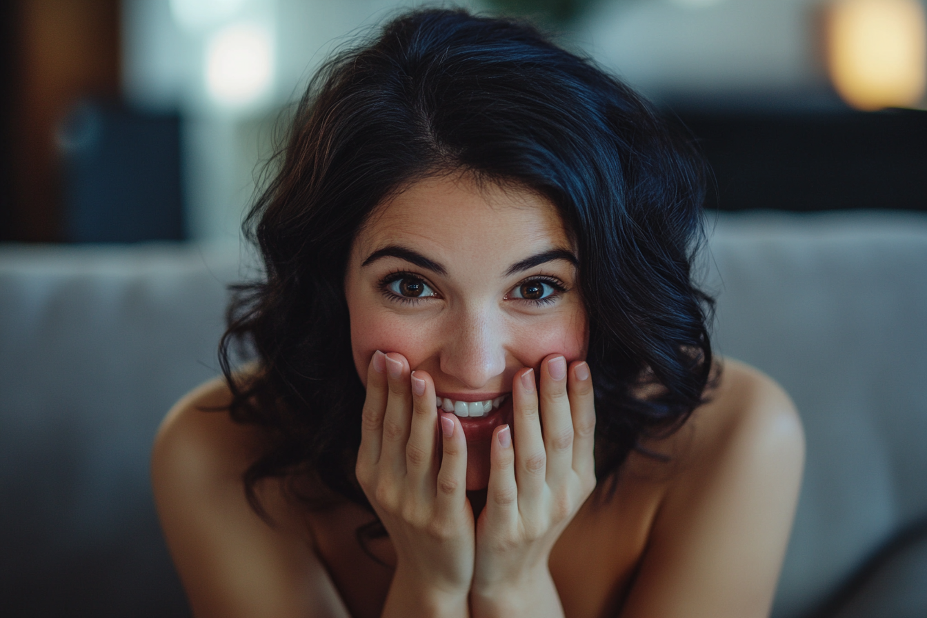 A woman smiling while speaking to someone | Source: No source