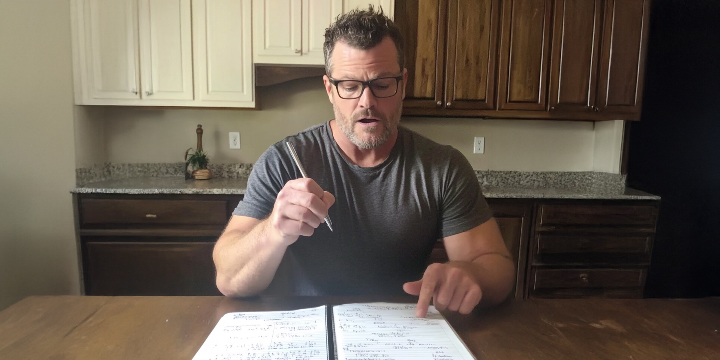 A serious-looking man making notes | Source: No source