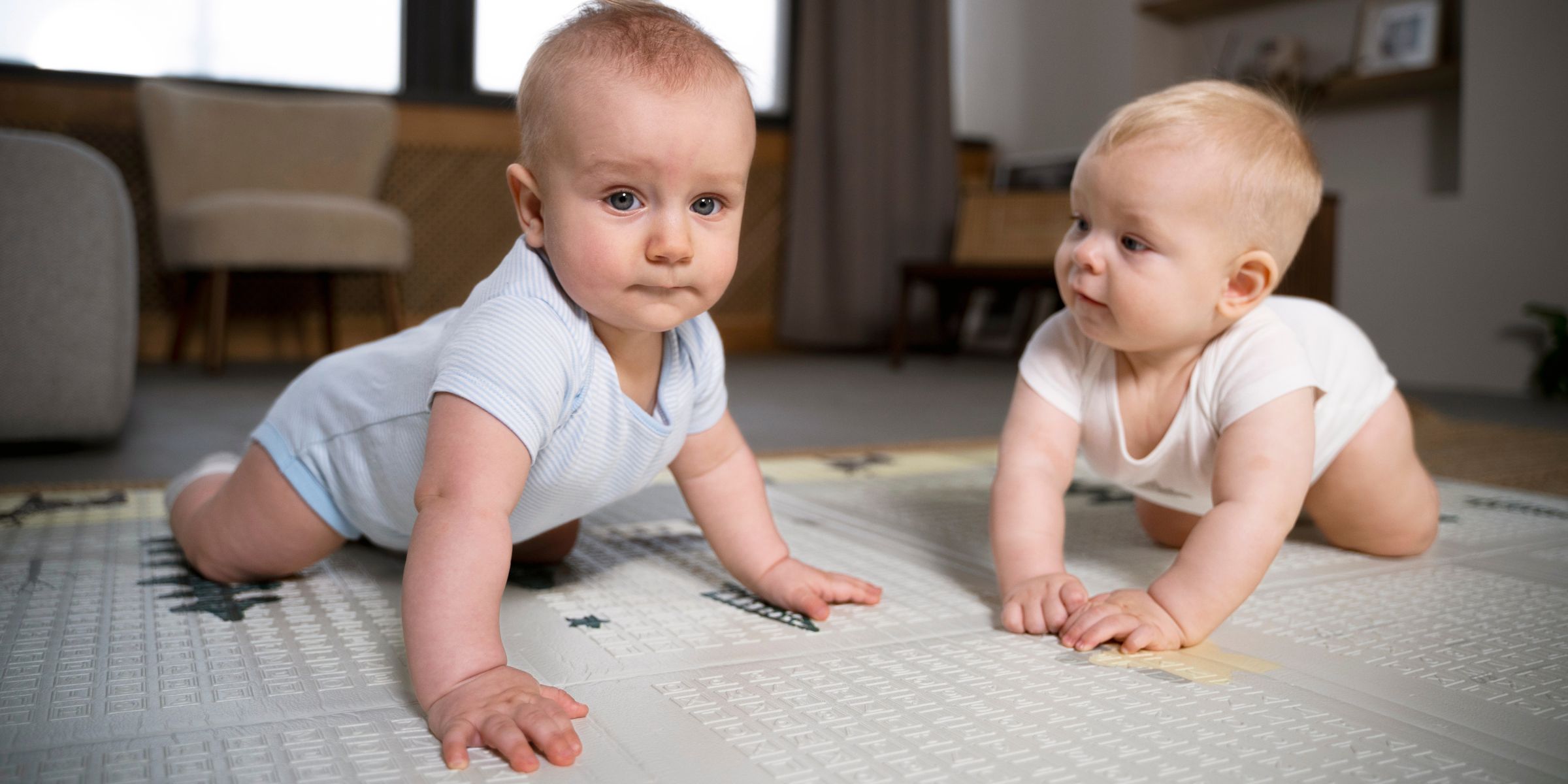 Twins crawling together | Source: No source