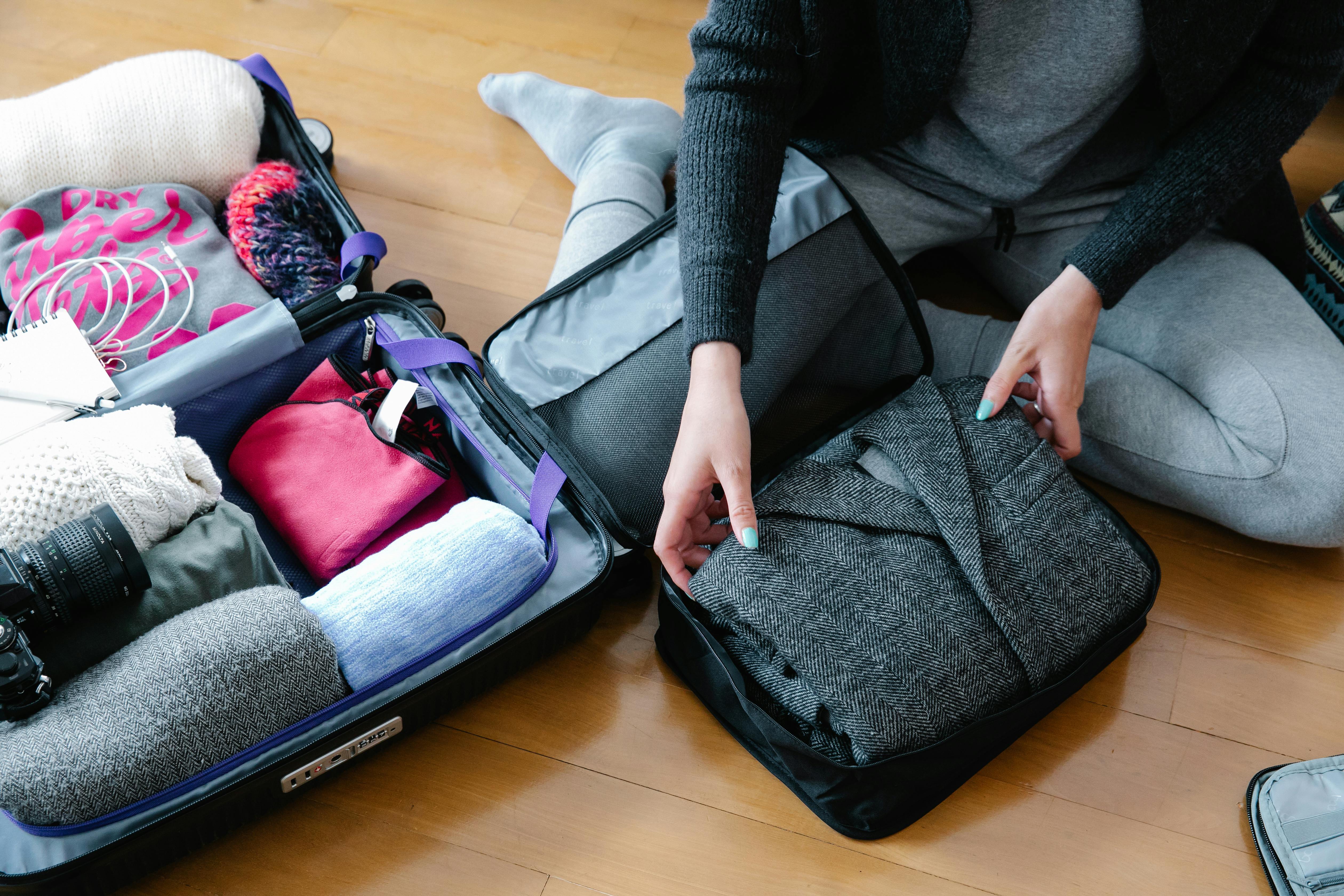 Woman packing her suitcase | Source: Pexels
