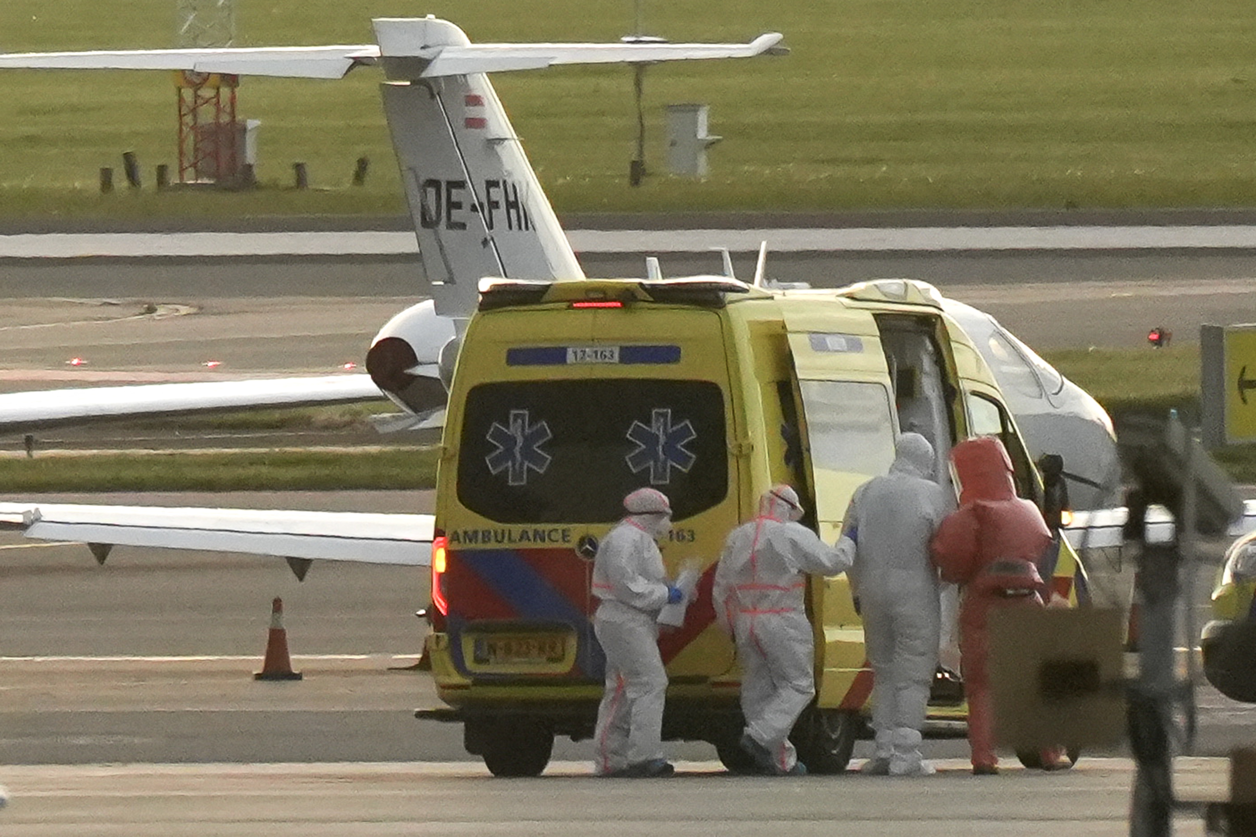 A person in a hazmat suit is escorted to a ambulance from a medical aircraft allegedly carrying some of the passengers from the cruise ship MV Hondius believed to be infected with hantavirus, at Schiphol airport near Amsterdam on May 6, 2026. | Source: Getty Images