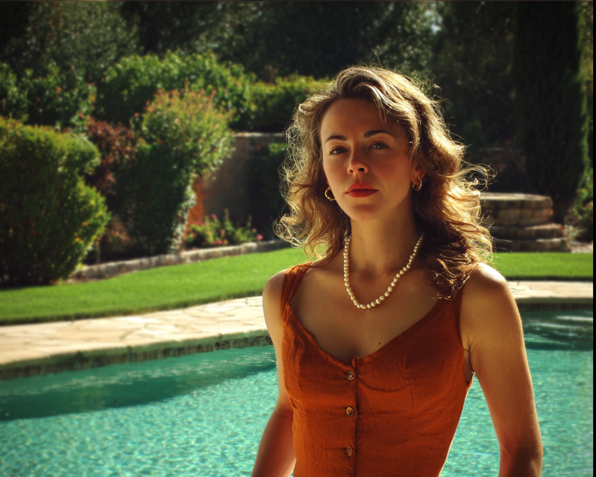 A pensive woman wearing a pearl necklace | Source:  no source
